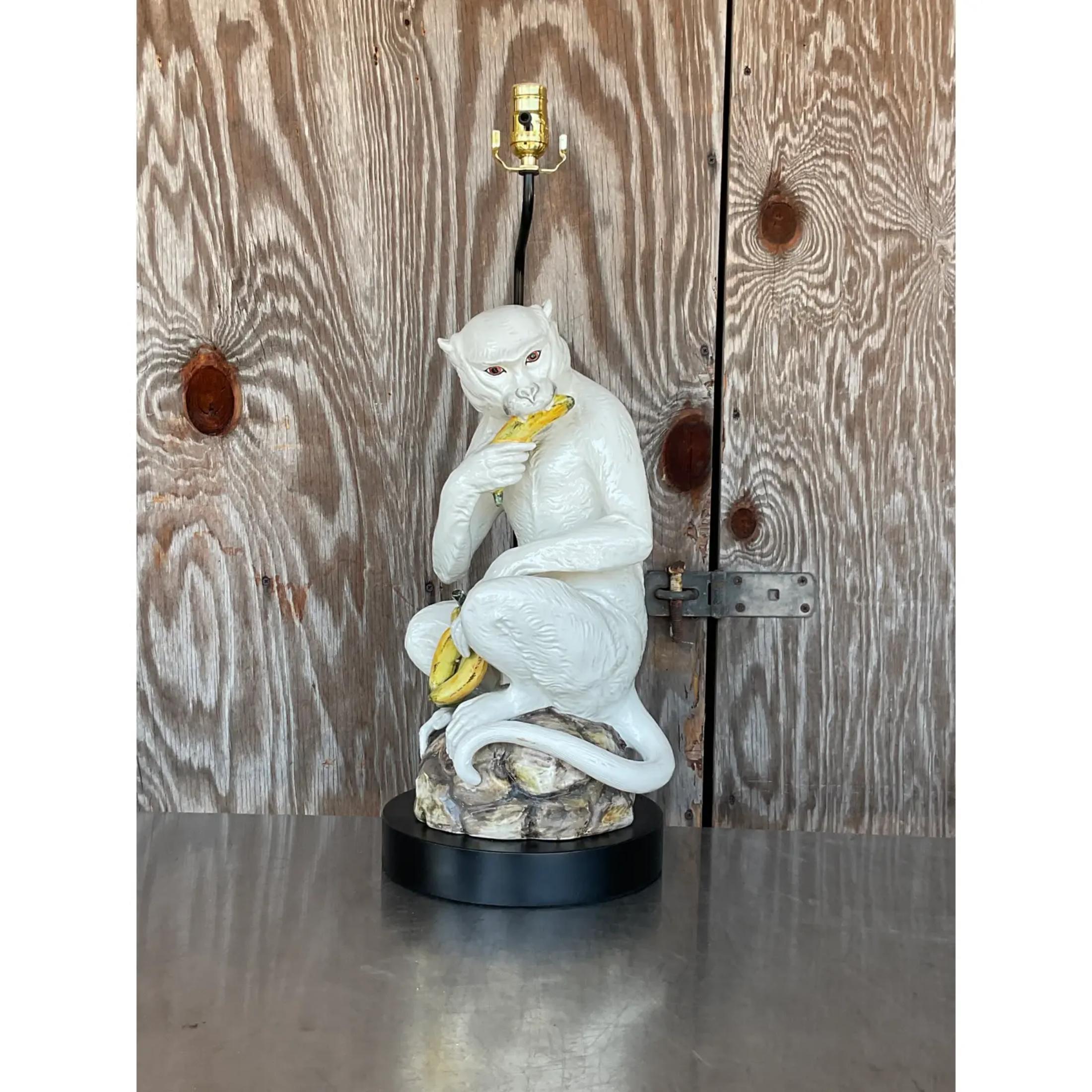 A stunning vintage Coastal table lamp. A chic Italian glazed ceramic monkey enjoying some bananas. Fully restored with all new wiring, hardware and plinth. Signed on the bottom of monkey. Acquired from a Palm Beach estate