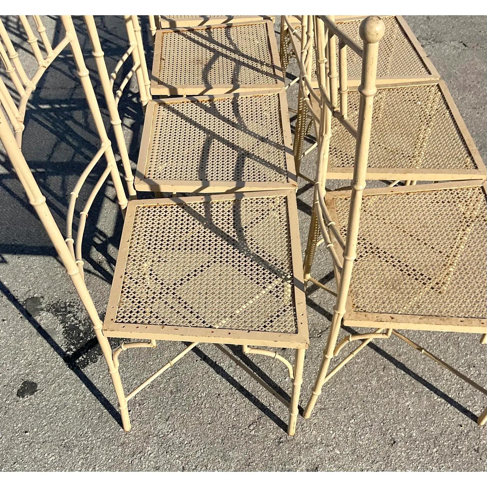 An exceptional set of 8 vintage outdoor dining chairs. Beautiful Italian metal chairs with a chic bamboo design. Perfect as is or have them redone in your favorite color. You decide! Acquired from a Palm Beach estate.

The chairs are in great