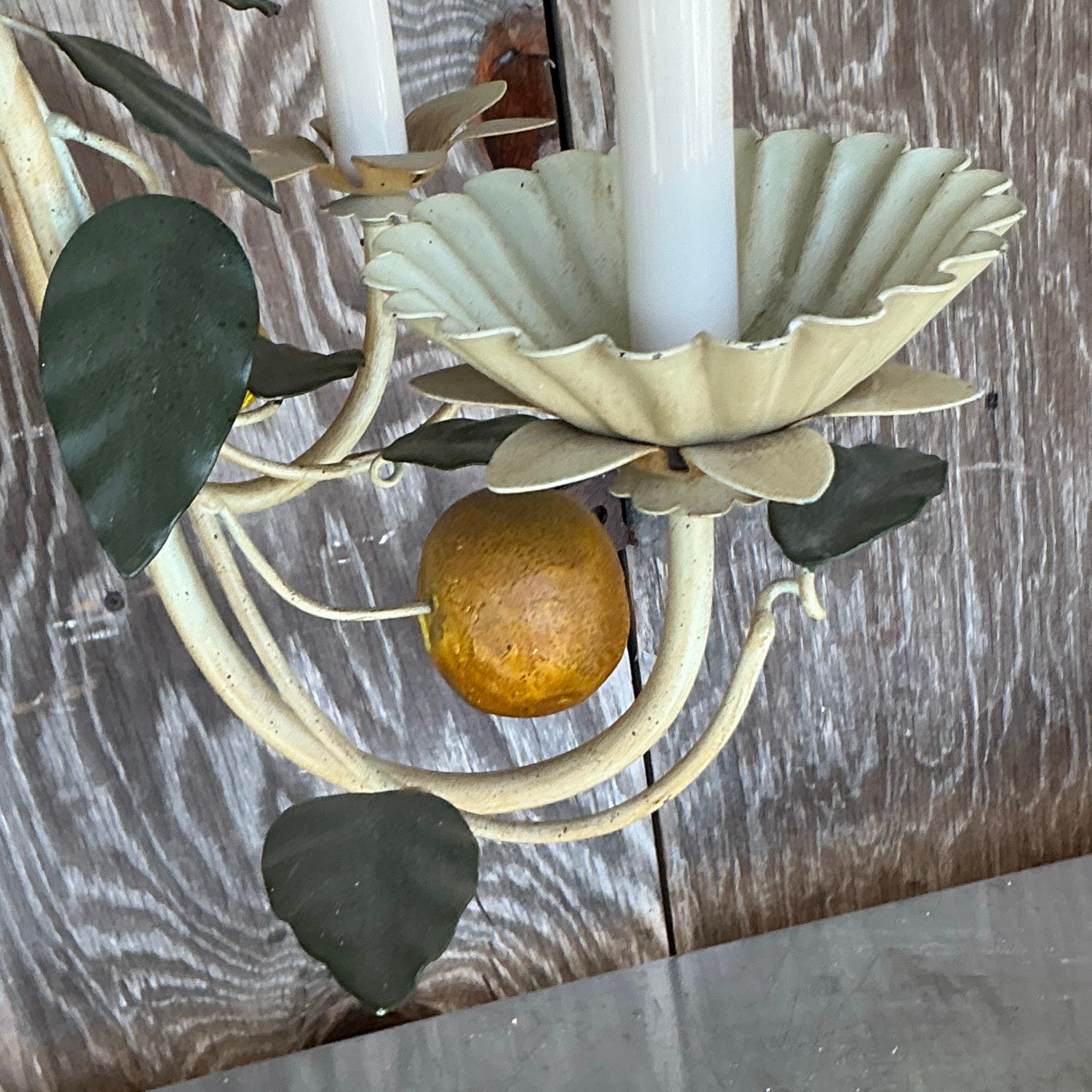 Brighten your space with a touch of coastal charm using this Vintage Italian Tole Lemon Chandelier. Perfect for American-style interiors, this delightful chandelier features vibrant tole lemons and intricate metalwork, bringing a fresh, whimsical
