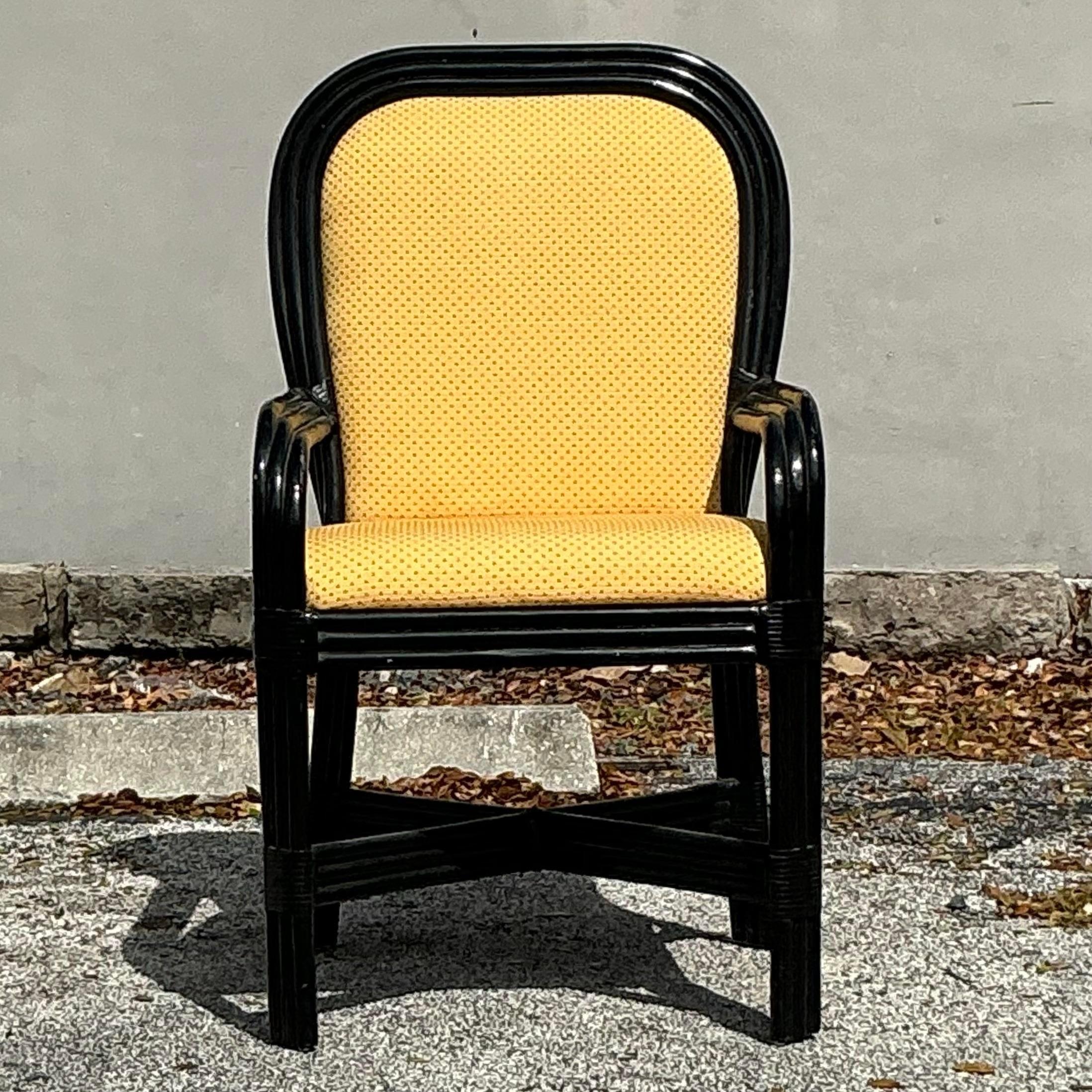 Enhance your coastal decor with this Vintage Coastal Lacquered Rattan Arm Chair, a stunning fusion of natural texture and modern polish. Featuring a sturdy rattan frame with an elegant lacquered finish, this armchair captures a relaxed, seaside vibe