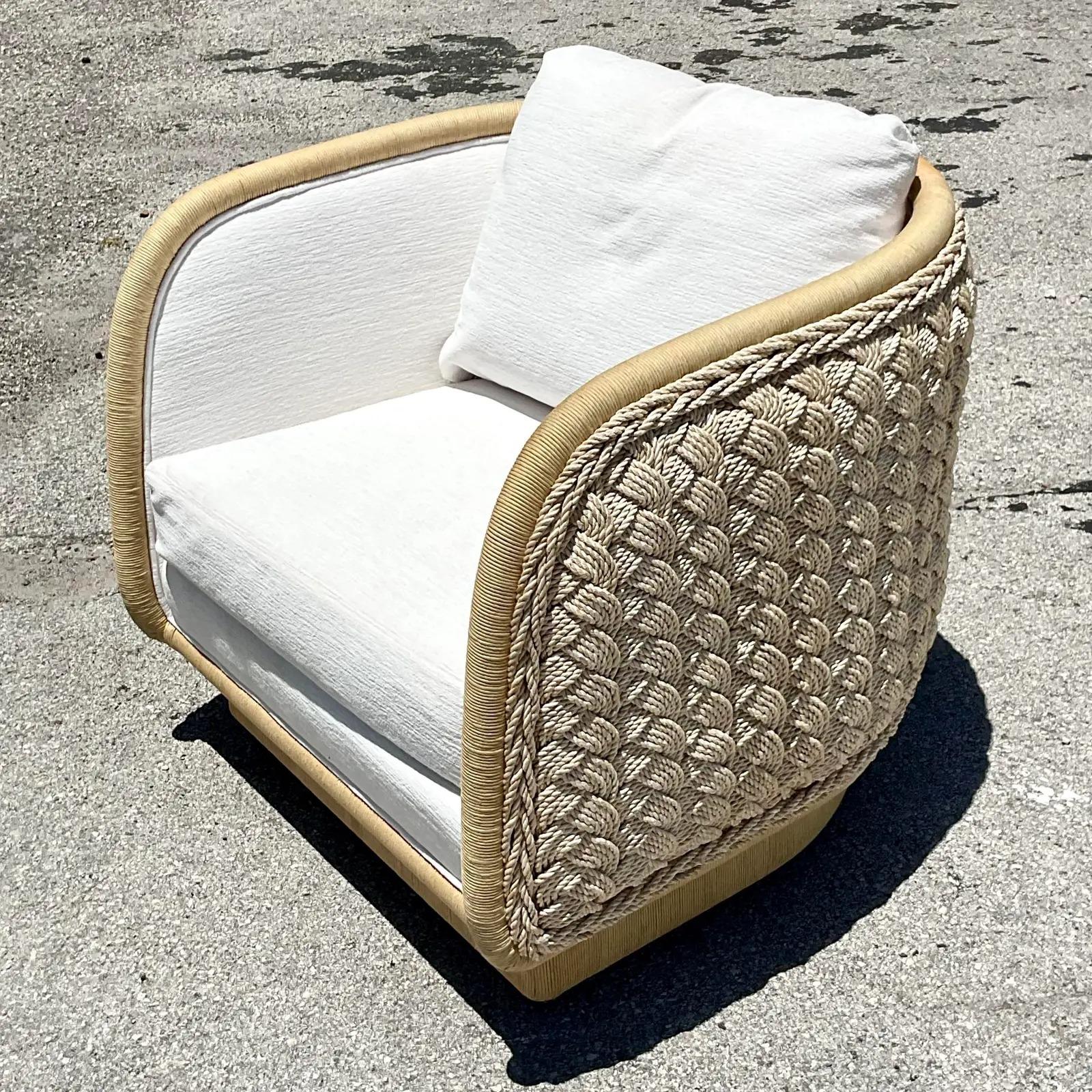 North American Vintage Coastal Laura Kirar Braided Rattan Swivel Chair