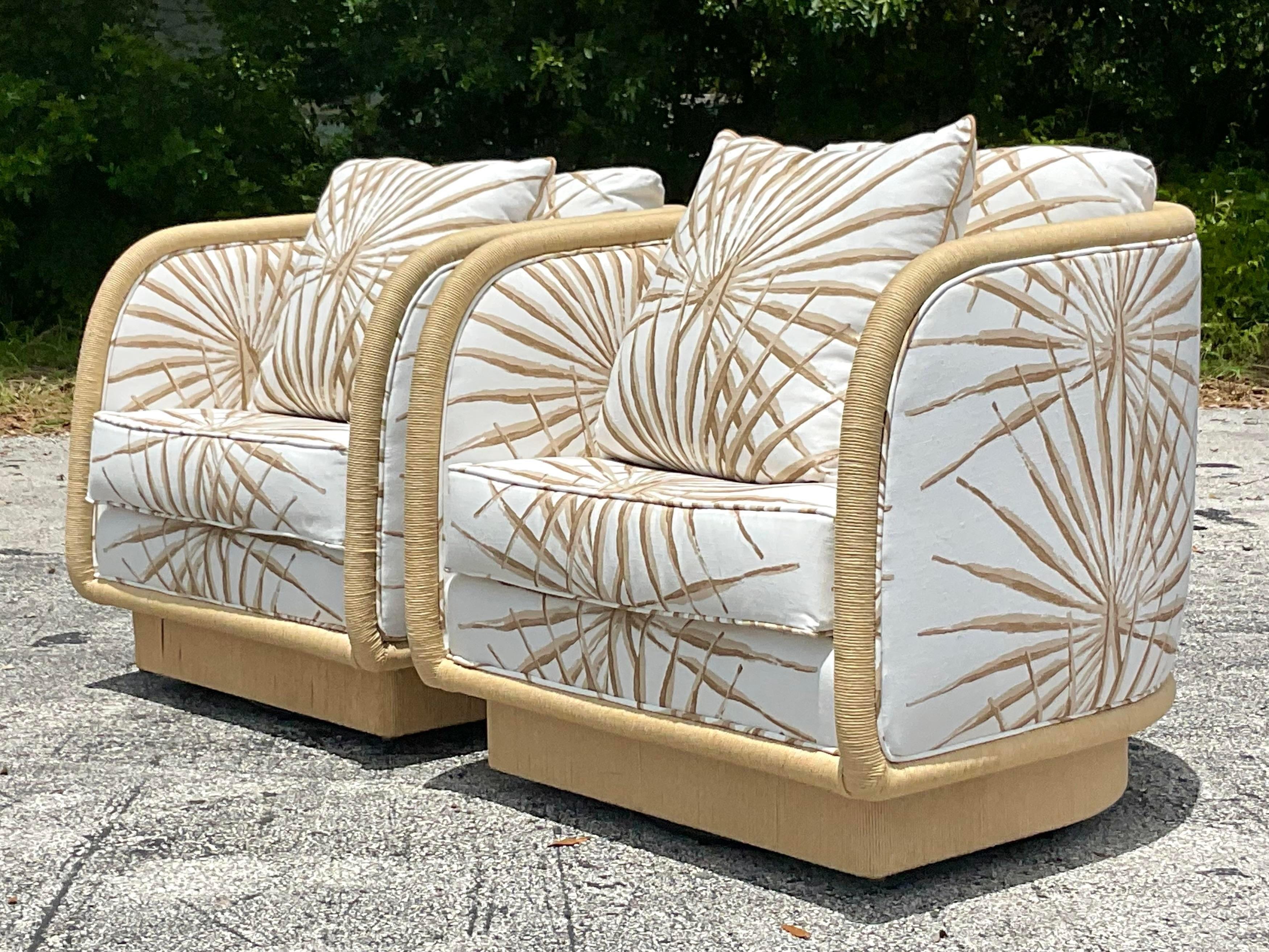 A fabulous pair of vintage Coastal swivel chairs. Designed by Laura Kirar for Baker Furniture. Chic wrapped Danish cord with a custom Palmetto stripe from the legendary Palm Beach store “The Hive”. In pristine condition. Acquired from a Palm Beach
