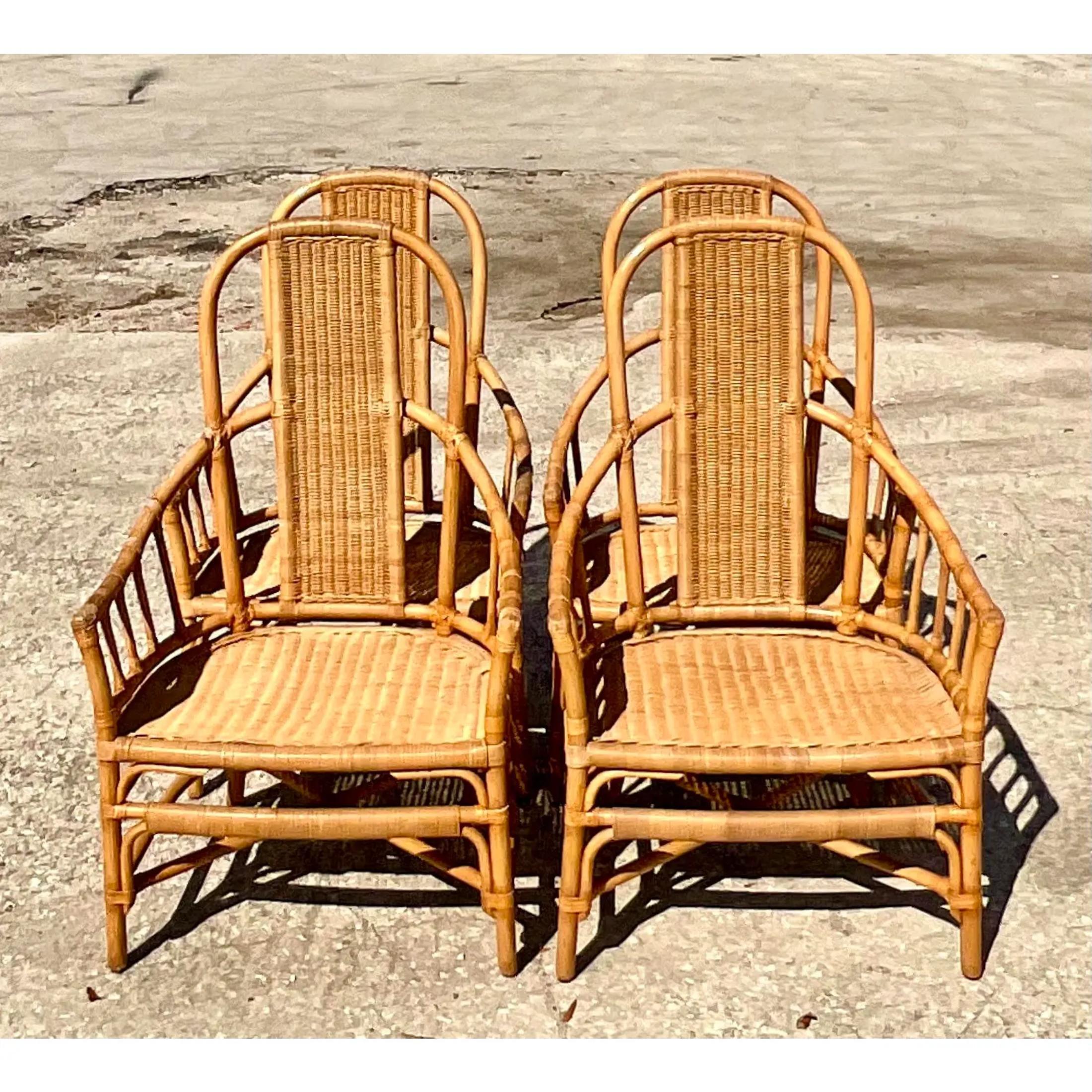 Fantastic set of 4 vintage Coastal dining chairs. Made by the coveted Mark David. Beautiful high arched backs with inset woven panels. Comfy wide seats for maximum relaxing. Acquired from a Palm Beach estate