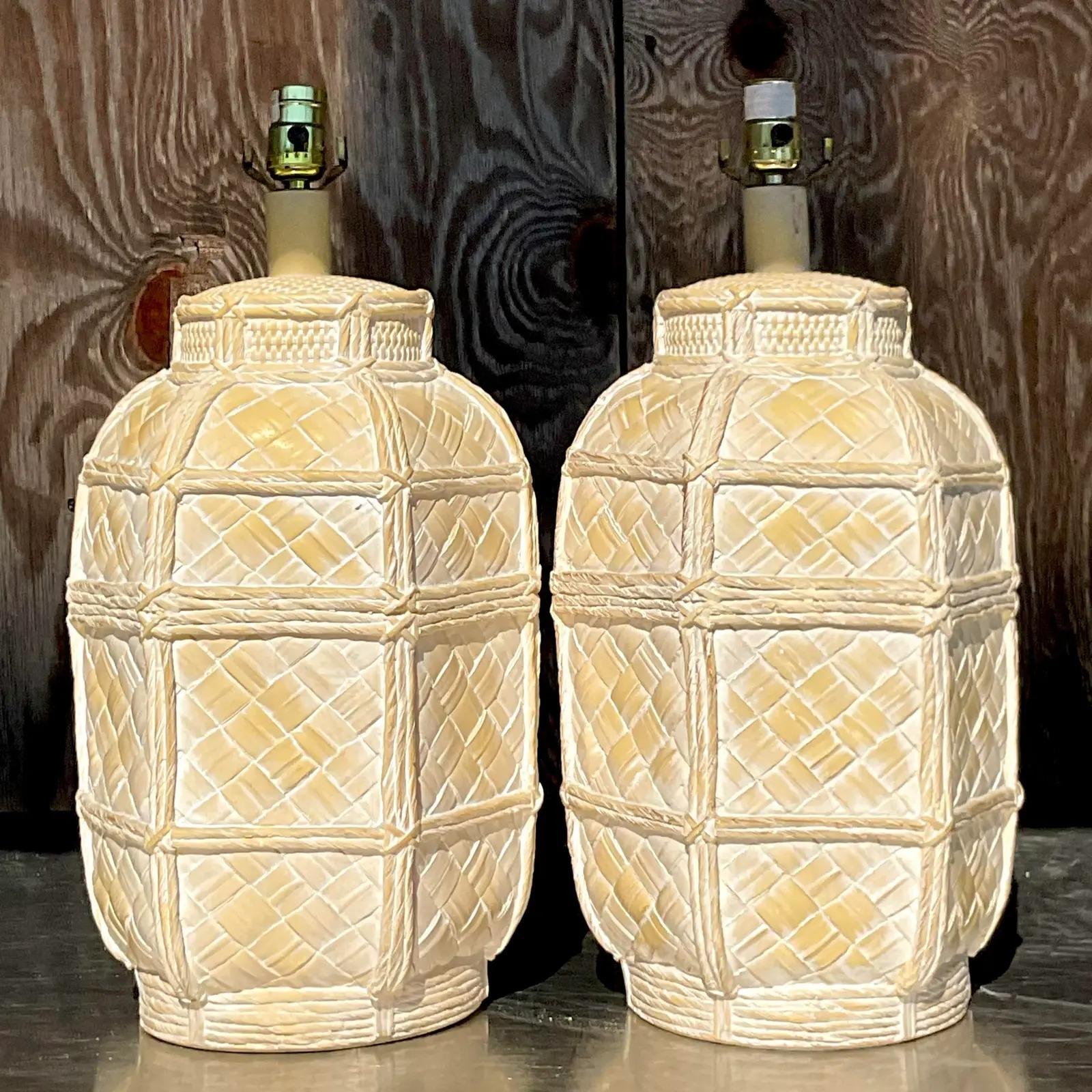 A fantastic pair of vintage Coastal table lamps. A chic matte glaze over a ceramic basket design. Acquired from a Palm Beach estate.