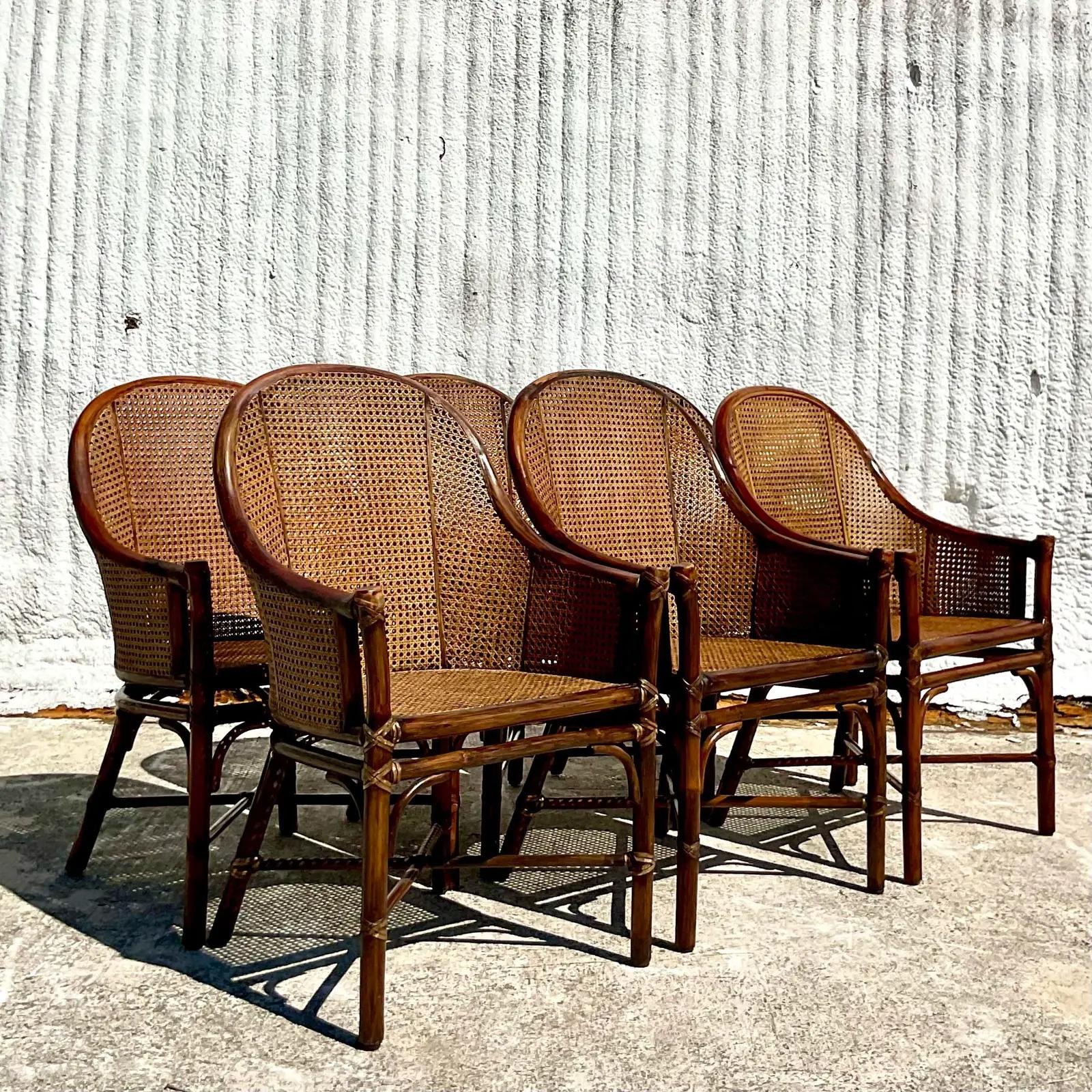 A fantastic set of 6 vintage Coastal dining chairs. Made by the iconic McGuire group in San Francisco. Gorgeous inset cane panels in a bent rattan frame. Acquired from a Palm Beach estate.

The chairs are in great vintage condition. Minor scuffs