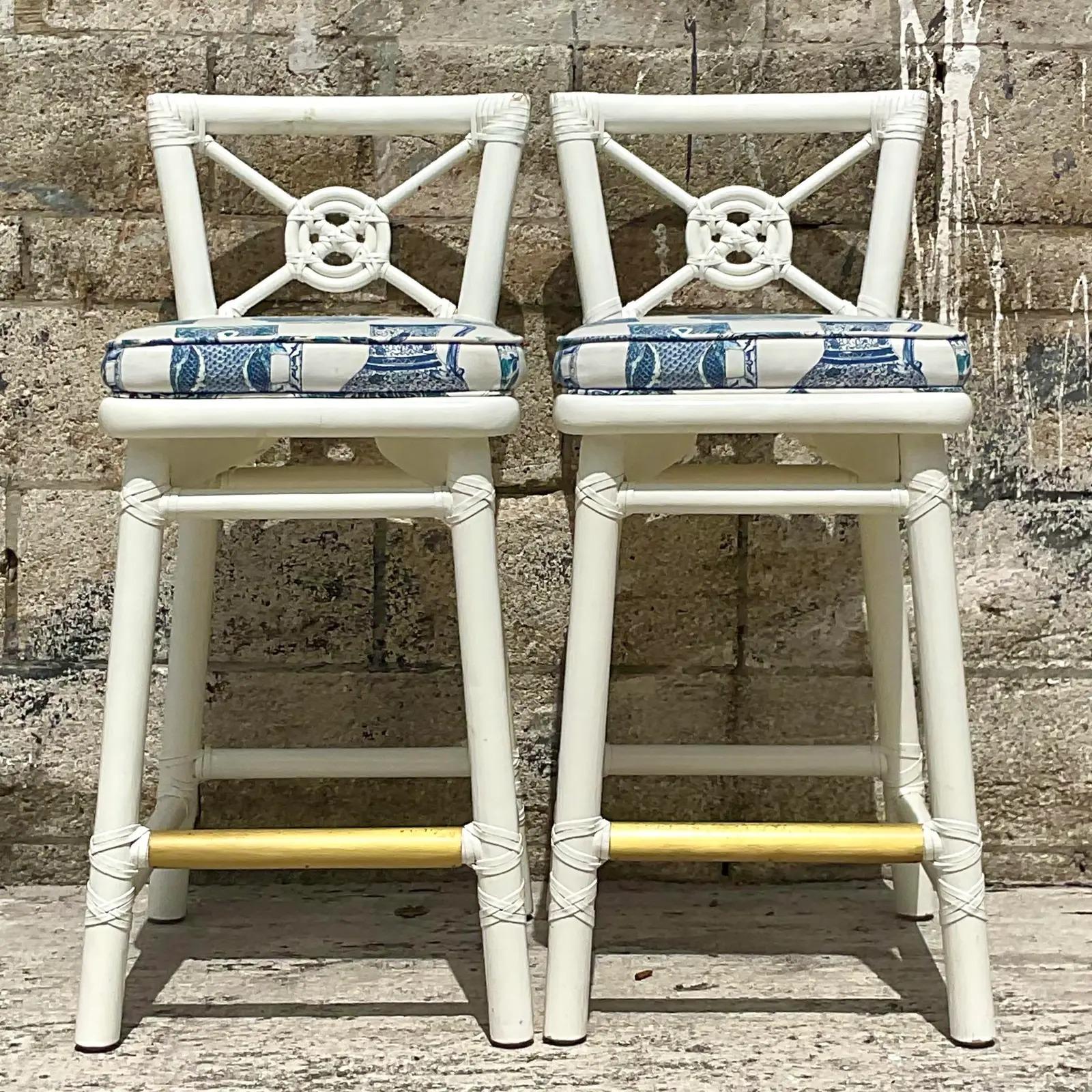 Fabulous pair of vintage Coastal bar stools. Made by the iconic McGuire group of San Fran beautiful Lacquered white finish with amazing blue and white ginger jar upholstery. Tagged on the bottom. Acquired from a Palm Beach estate.