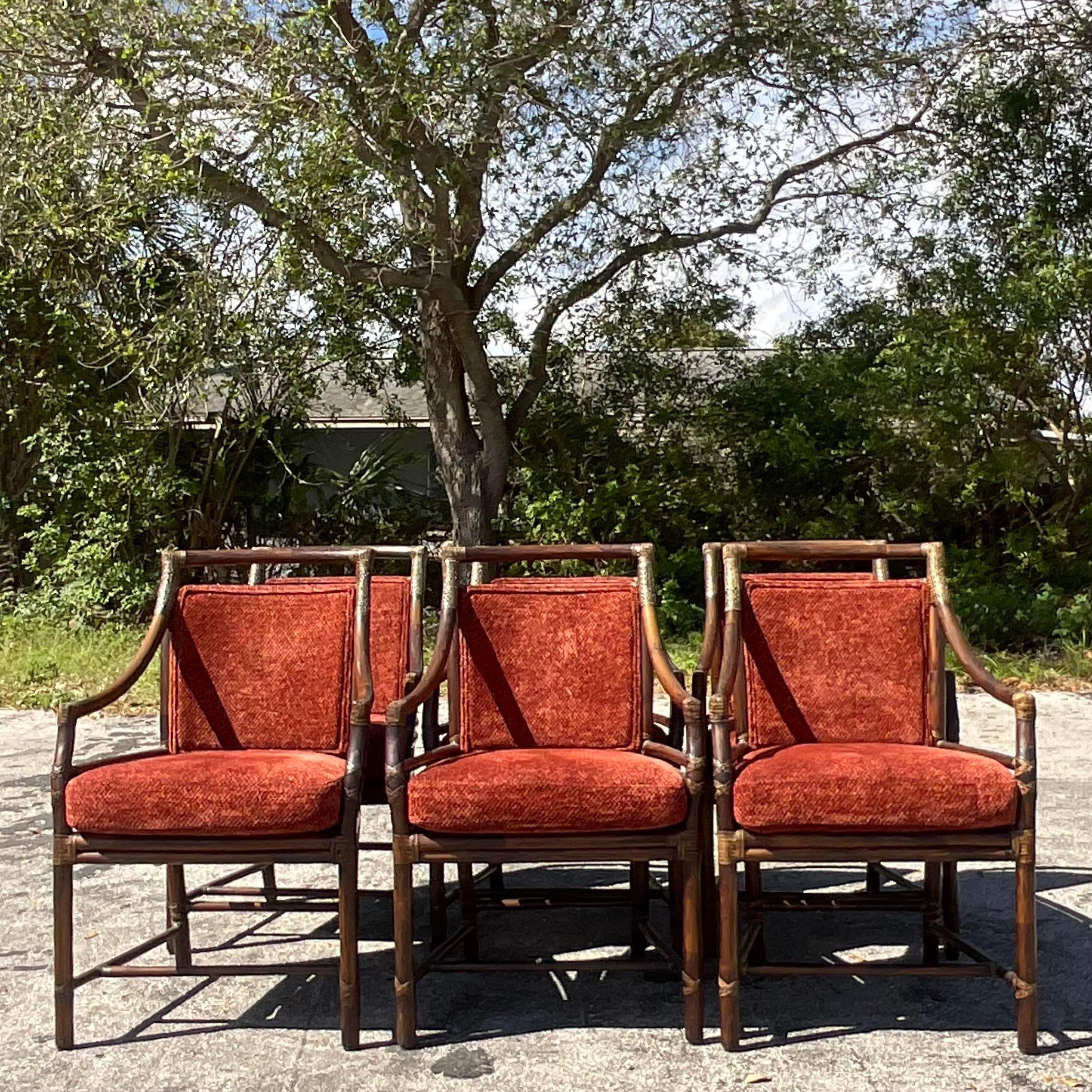 A stunning set of six vintage a coastal dining chairs. Made by the iconic McGuire group and tagged on the bottom. The coveted target back design in bent rattan. Acquired from a Palm Beach estate.