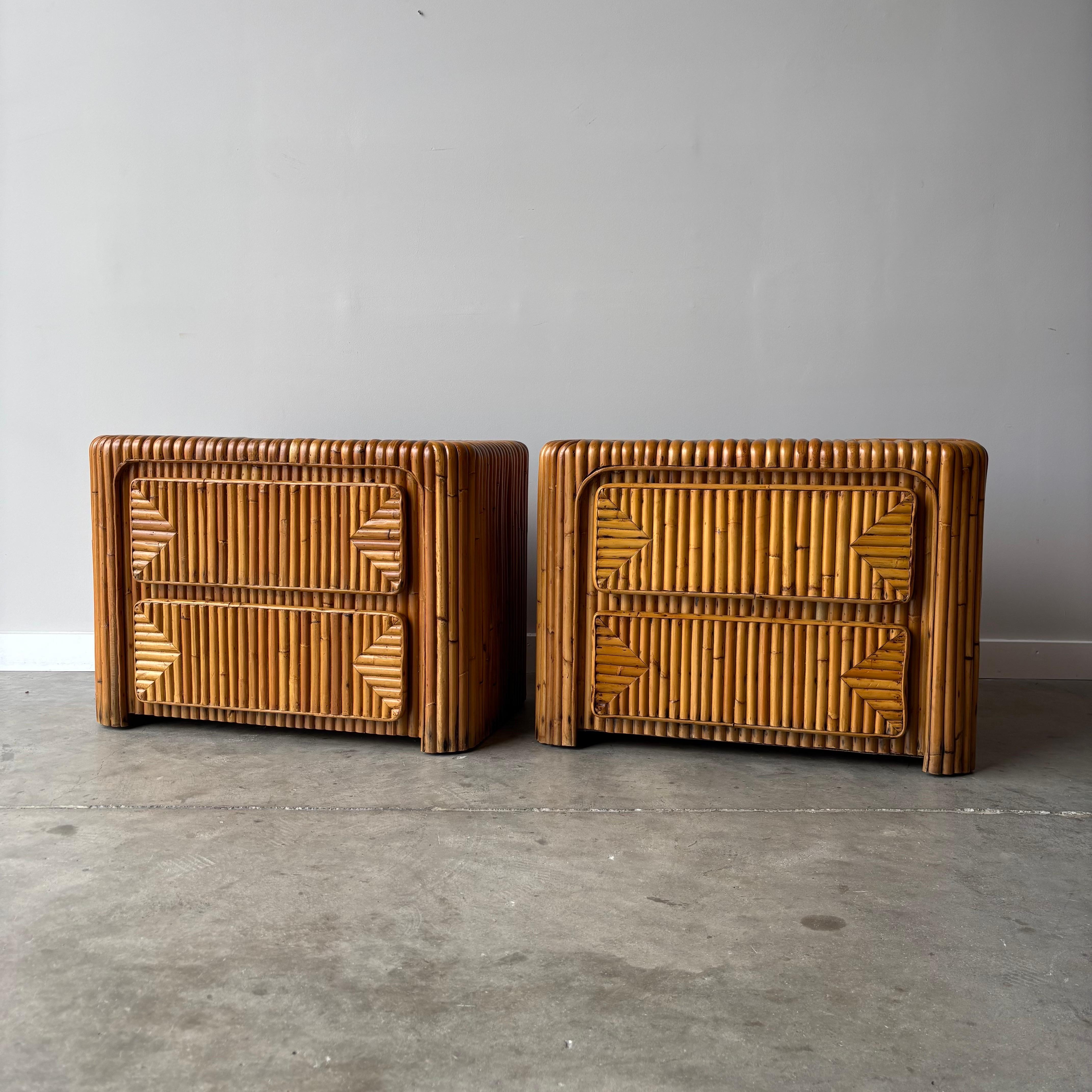 A stunning pair of vintage bamboo nightstands.   The striated bamboo offers texture and depth to the two drawer cabinets.  A unique coastal modern set newly refinished and ready for placement.  