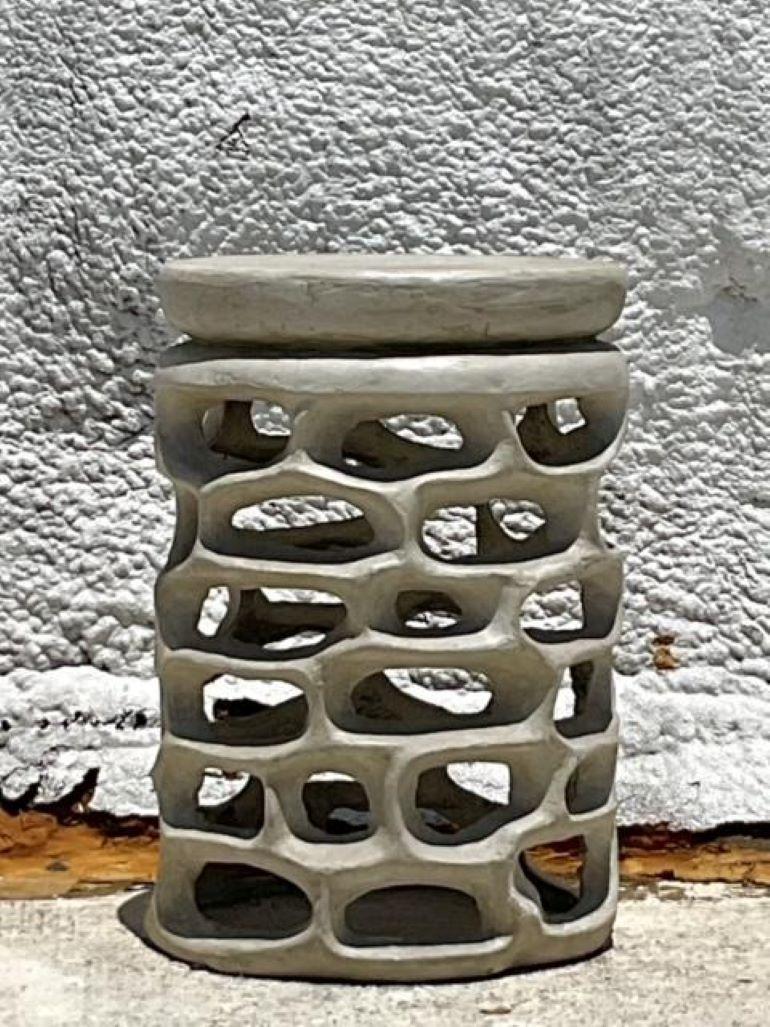 Elevate your coastal aesthetic with the Vintage Coastal Molded Resin Low Stool. Crafted with the charm of Americana in mind, this stool blends classic design with durable resin construction, providing a versatile and stylish seating solution for any
