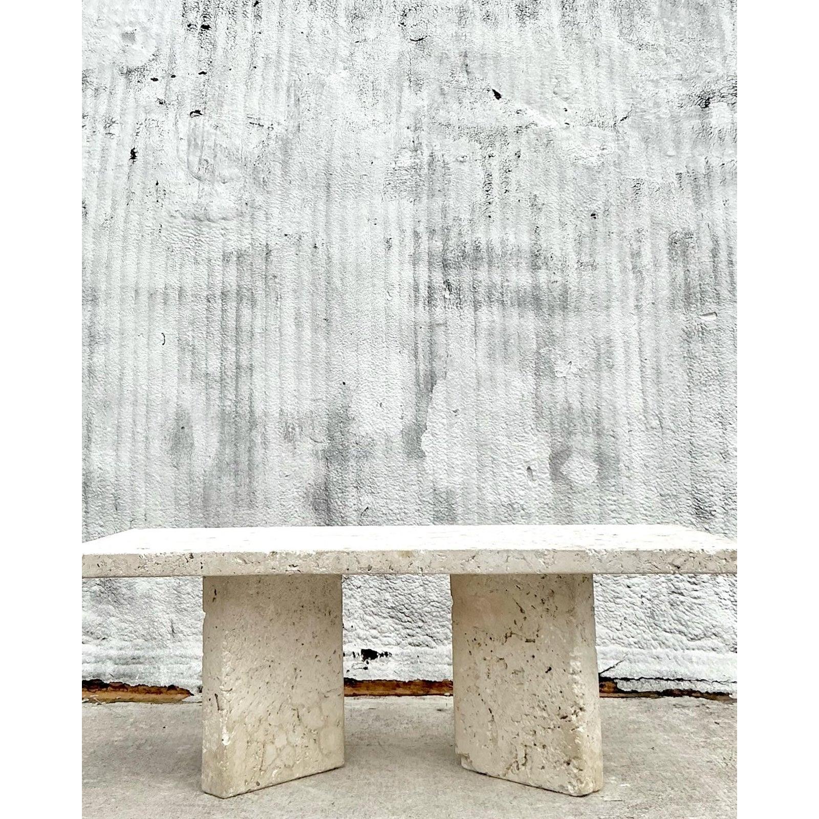 Elevate your space with the earthy elegance of this Vintage Coastal Monumental Coquina Slab Dining Table. Handcrafted from solid coquina stone, this statement piece celebrates organic design with a raw, tactile surface and monolithic silhouette that