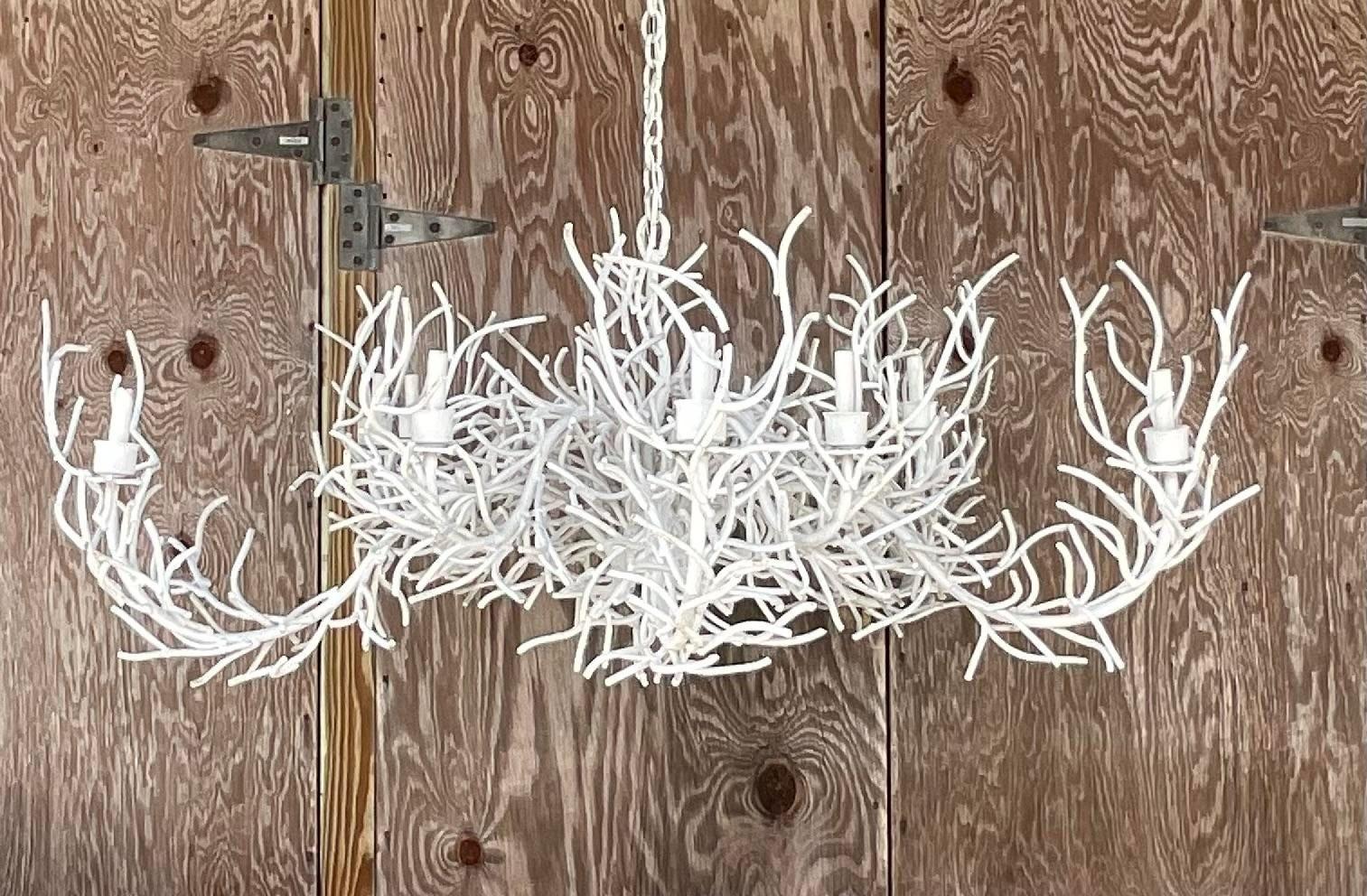 A spectacular vintage Coastal chandelier. Monumental in size and drama. Chic coral branches in a painted metal. Perfect as is or paint to suit your project. Acquired from a Palm Beach estate.