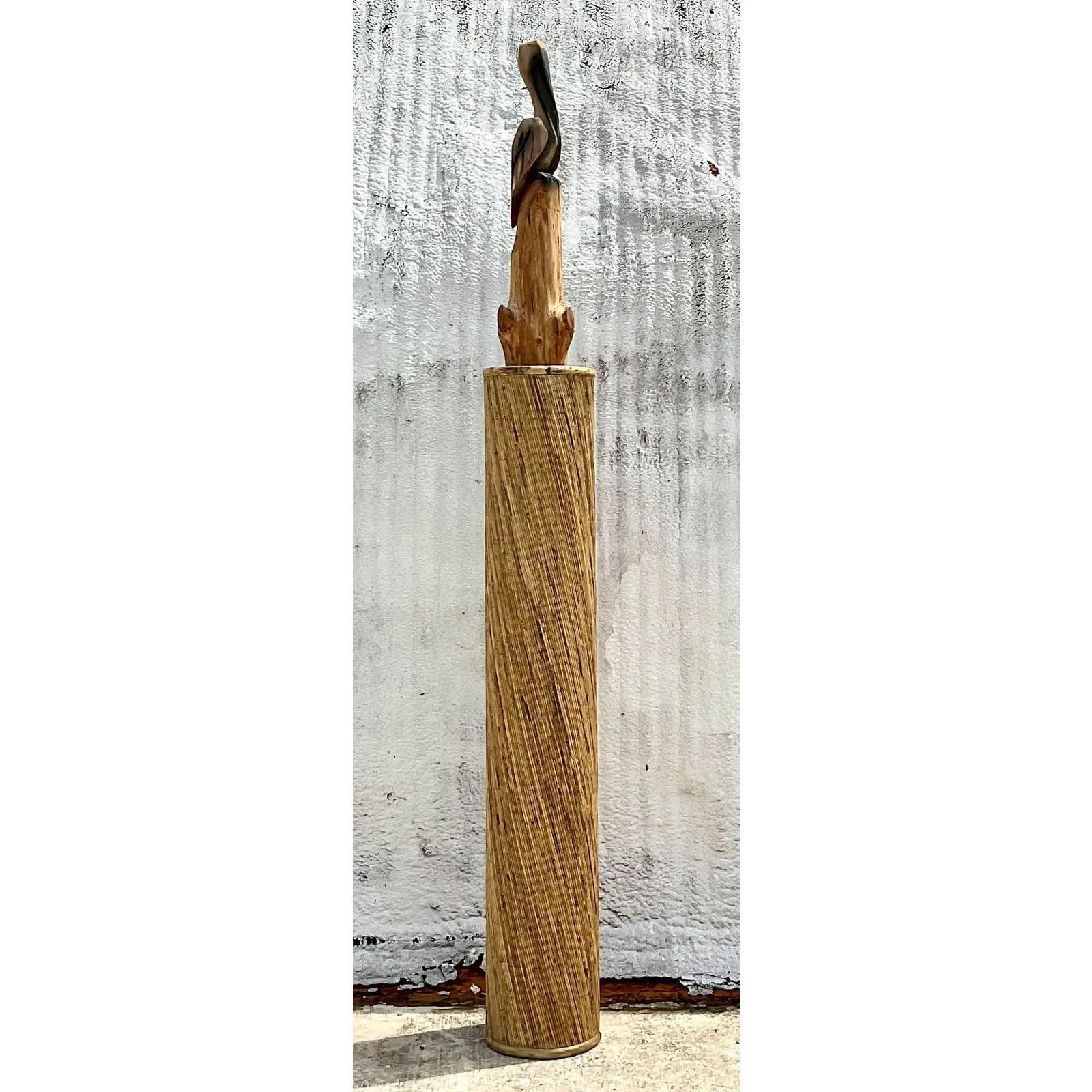 A gorgeous vintage Coastal tall column. Constructed of a coiled pencil reed in a tortoise finish. Perfect as a stand alone column or a tall sculpture pedestal. You decide! Acquired from a Palm Beach estate. 