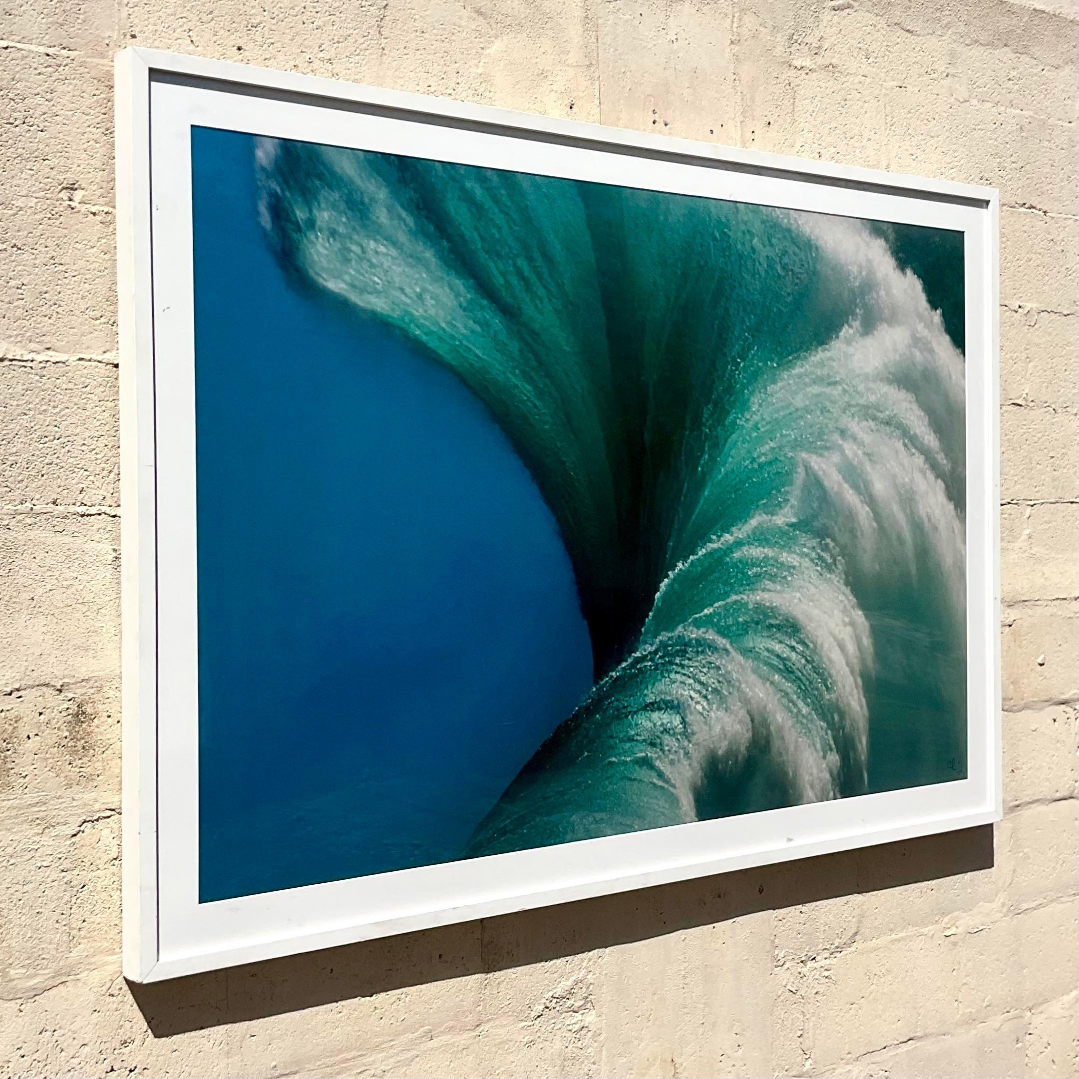 Immerse yourself in the majesty of the sea with this Vintage Monumental Coastal Signed Ray Collins Wave Photograph, capturing the raw power and beauty of American coastal landscapes. Signed by the renowned artist Ray Collins, this photograph offers