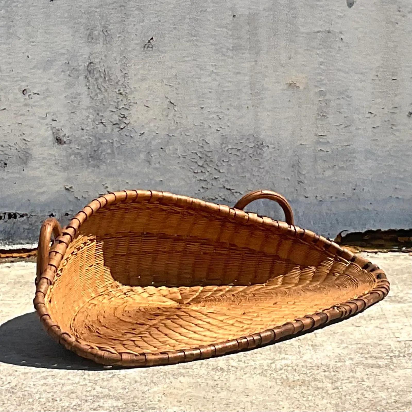 A fabulous vintage coastal basket. A unique shape that has so many possibilities. Beautiful as a wall hanging, a centerpiece or even a super chic dog bed. Brought from New Zealand to the US. Acquired from a Hobe Sound estate.