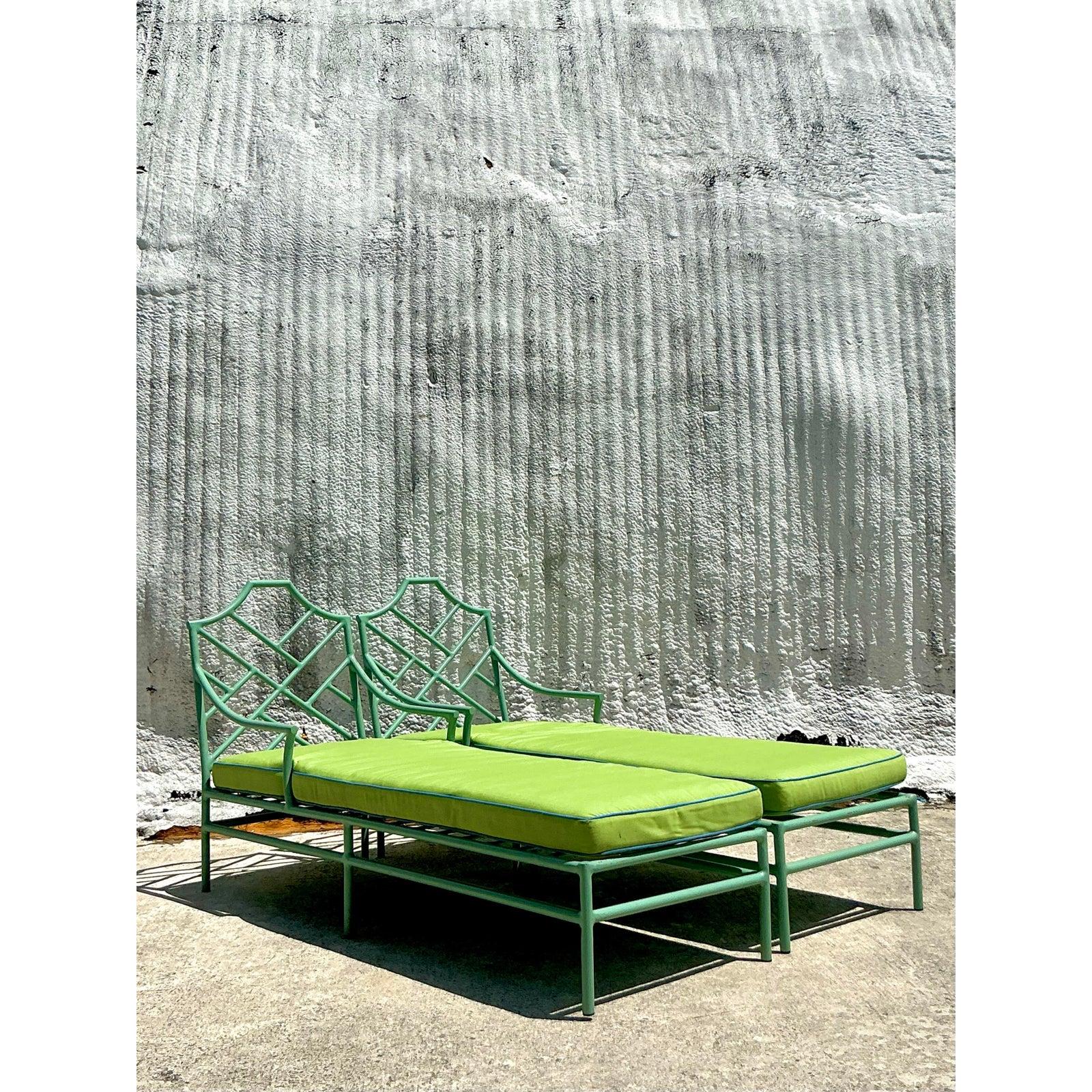 Add an exotic splash of vintage luxury to your outdoor or indoor space with this stunning pair of Chinese Chippendale-style chaise lounges by O’Brien Iron Works. Expertly crafted from powder-coated wrought iron, each piece features intricate faux