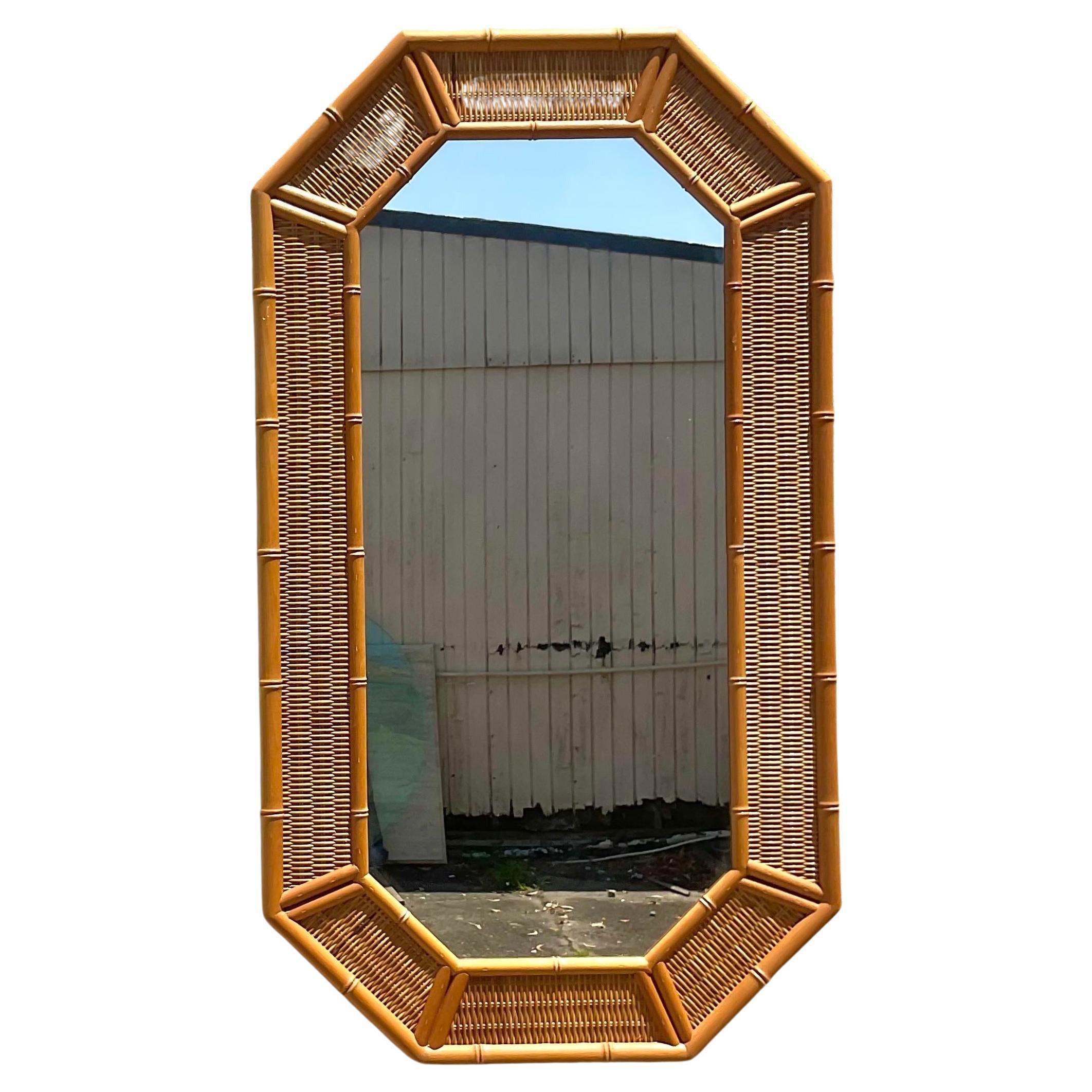 Bring coastal charm to your space with our Vintage Coastal Octagon Woven Rattan Mirror. American-crafted with a unique octagon shape and woven rattan detailing, this mirror combines classic design with natural elements, offering a breezy and elegant
