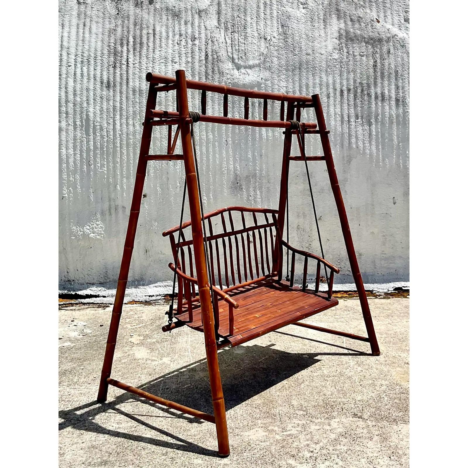 Fantastic vintage bamboo and rattan outdoor porch swing. Beautiful elephant rattan in a monumental size. Acquired from Palm Beach estate.