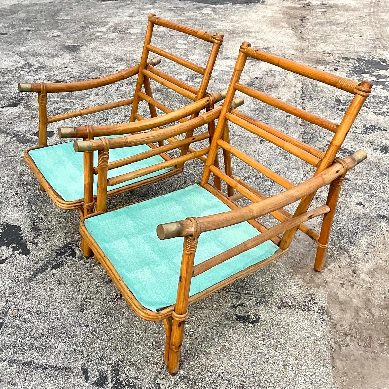 An exceptional set of vintage Coastal rattan sofa set. Beautiful pagoda shape done in the manner of John Wisner for Ficks Reed. Chic brass end caps. Sectional sofa, two lounge chairs, coffee table and one side table. So rare to find a complete set