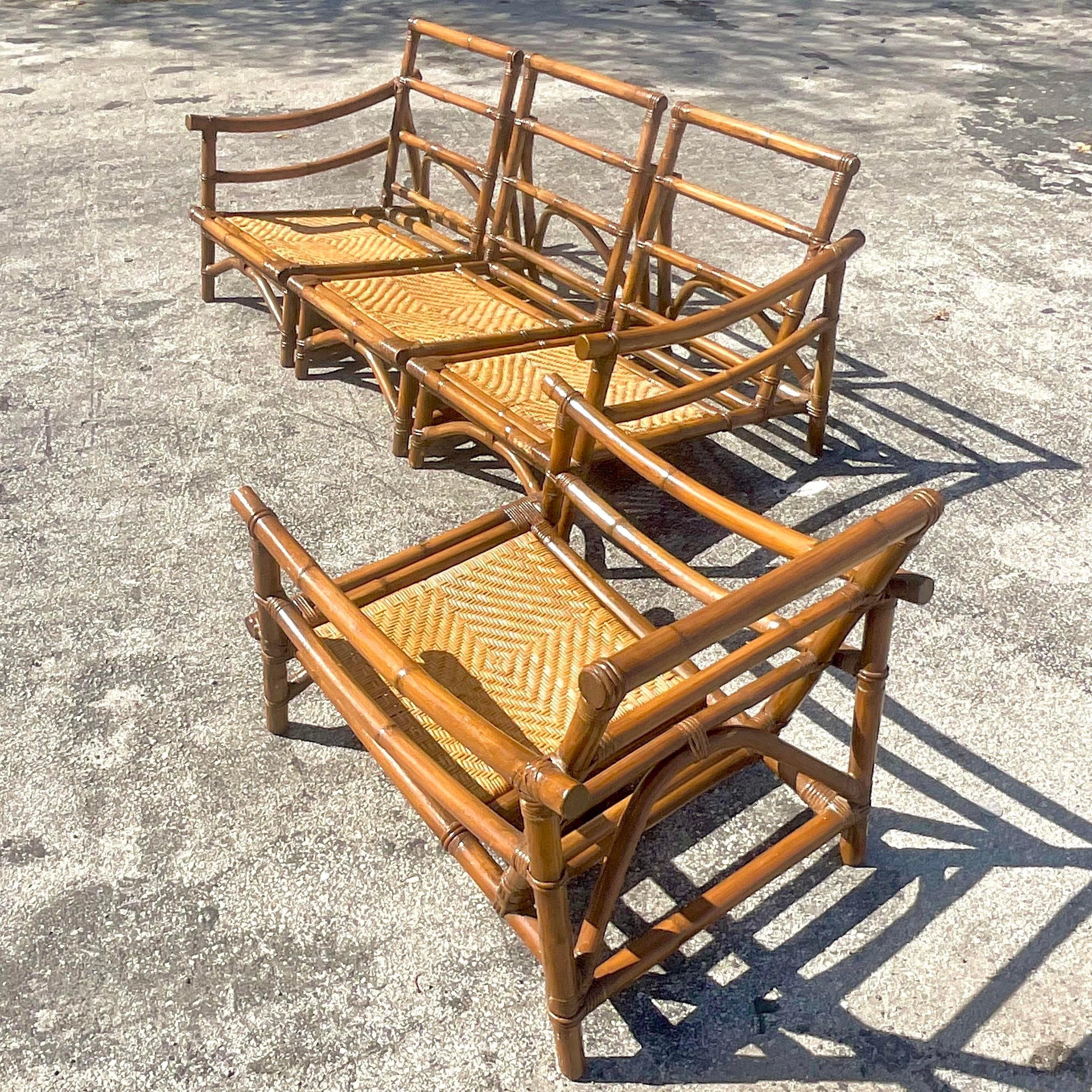 A fabulous vintage Coastal Bent rattan sofa set. Made by the iconic Calif-Asia group. Don’t in the manner of John Wisner with the coveted Pagoda arms. Inset woven rattan seat panels. Acquired from a Palm Beach estate.