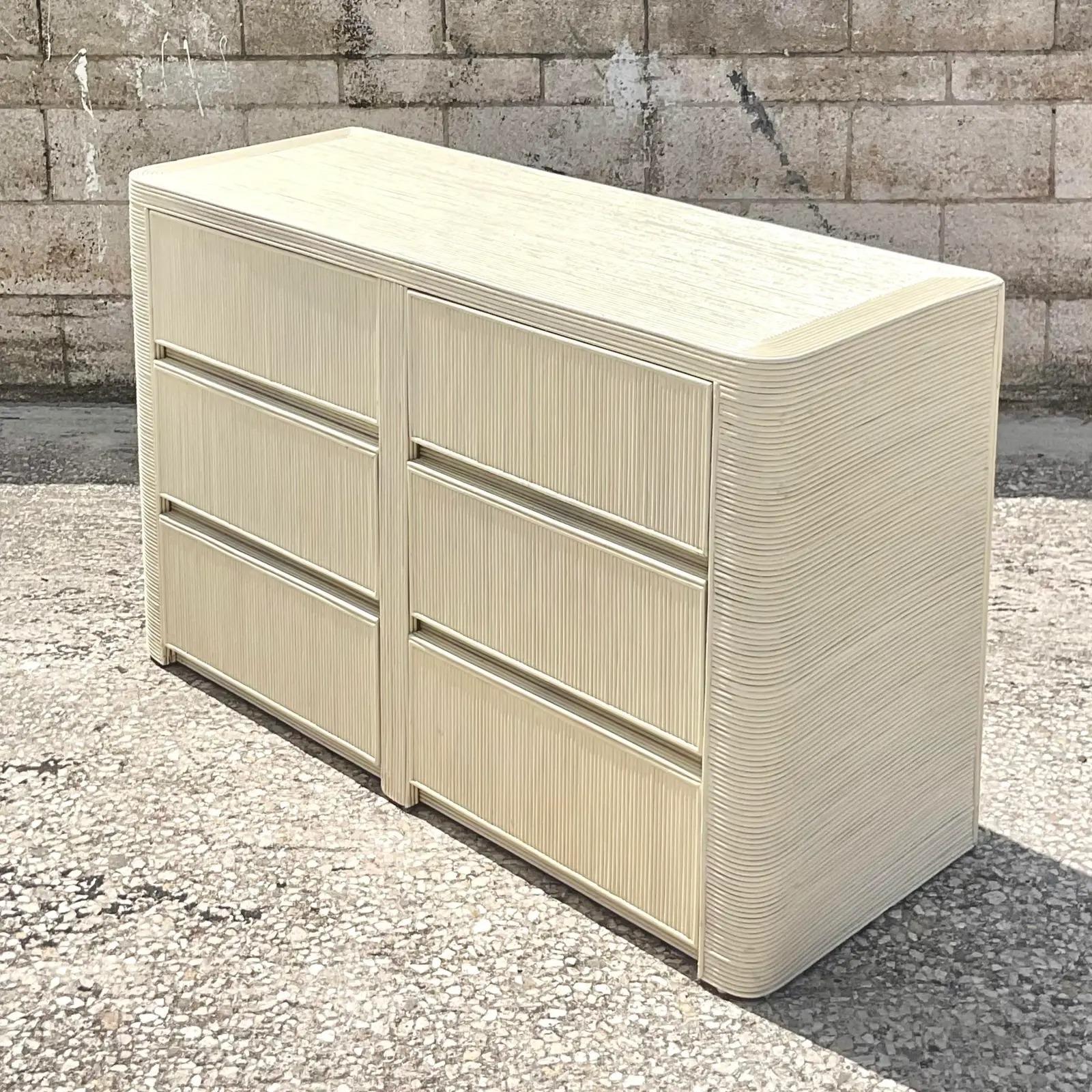 Fantastic vintage pencil reed dresser. Gorgeous painted finish in a chic neutral color. Six deep drawers with a rounded edge. Acquired from a Palm Beach estate.