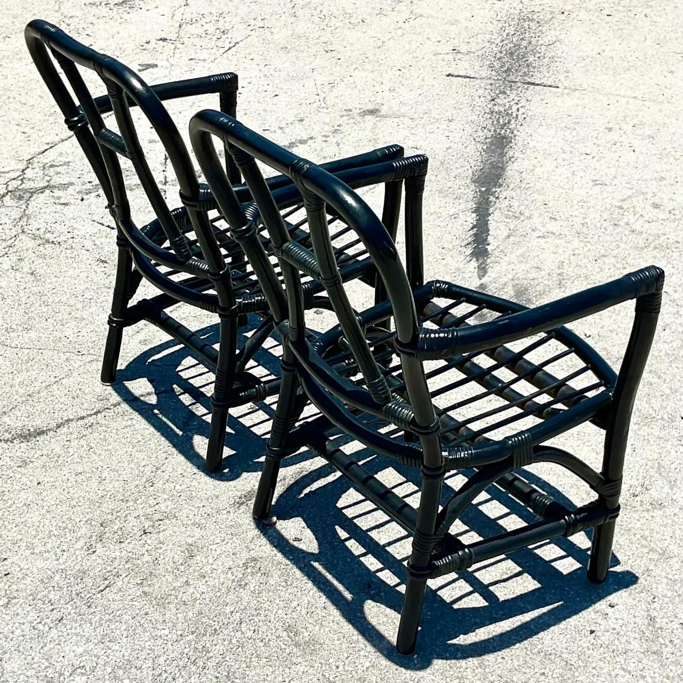 A fantastic pair of vintage Coastal slipper chairs. Beautiful black painted frames with a chic design. Matching arm chairs also available on my Chairish page. Acquired from a Palm Beach estate