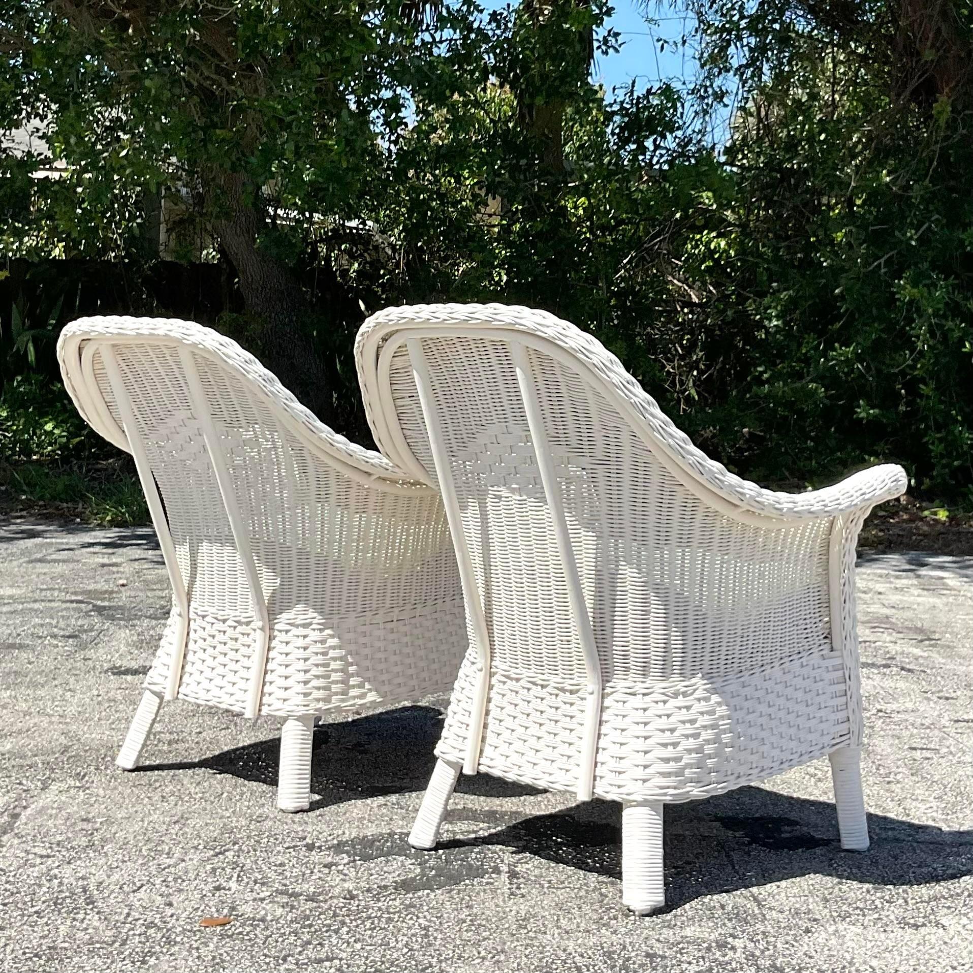 Elevate your coastal retreat with our Vintage Coastal Palecek Diamond Weave Lounge Chairs - A Pair, embodying classic American craftsmanship and coastal allure. Featuring intricately woven rattan in a timeless diamond pattern, these chairs blend