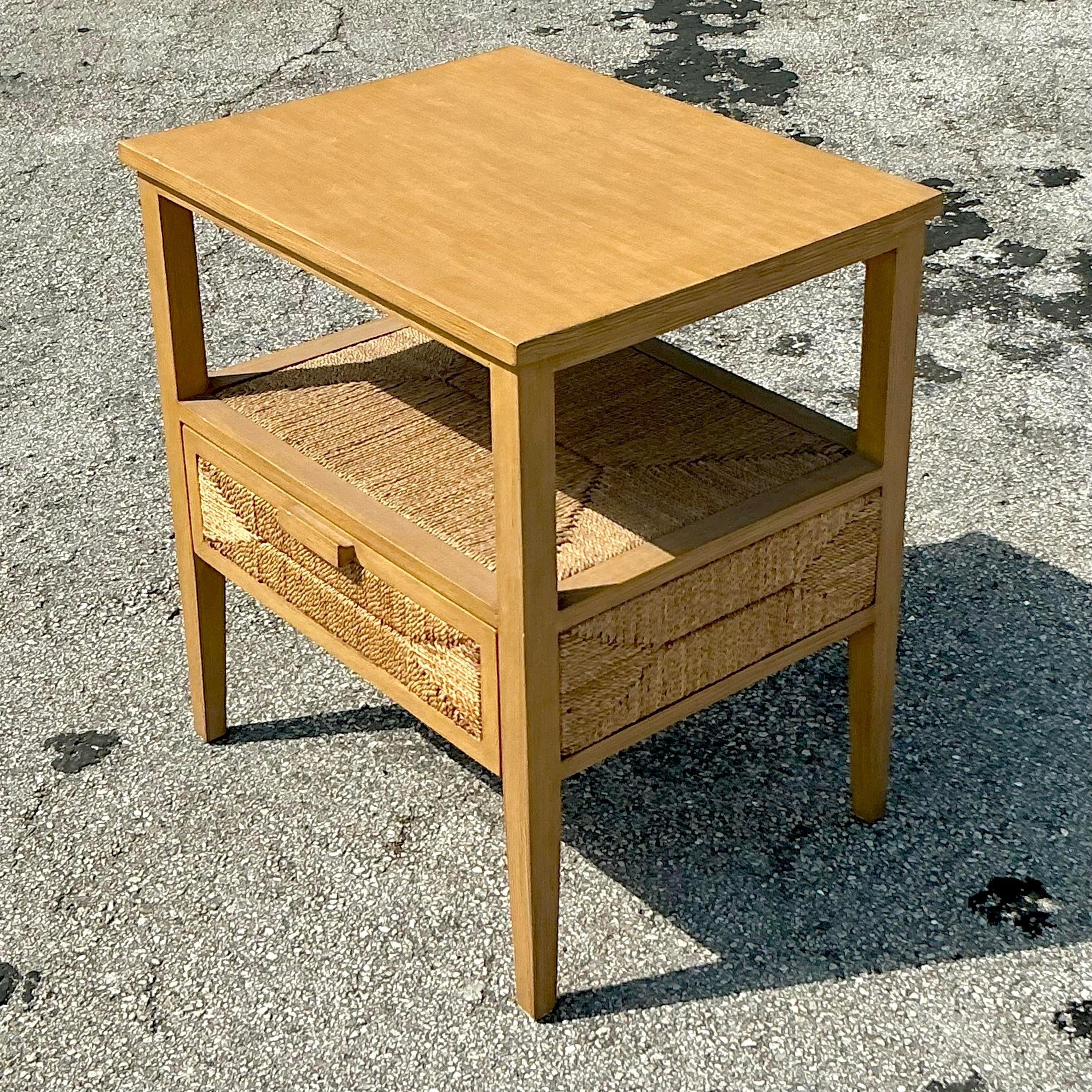 This vintage coastal nightstand by Palecek features a beautifully wrapped jute exterior, adding earthy texture and breezy charm to any bedroom. Its sturdy build and natural tones make it a perfect choice for coastal or bohemian decor, creating a