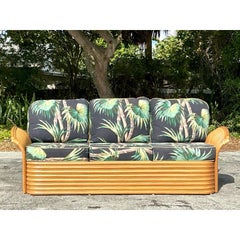 Sofa vintage en rotin imprimé palmier côtier