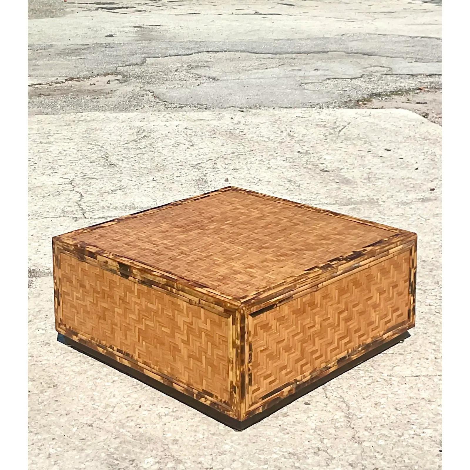Fabulous vintage Parquet rattan coffee table. A beautiful and versatile design with chic tortoise shell finish on the trim. Perfect as is or just add glass for extra glamour. Acquired from a Palm Beach estate.