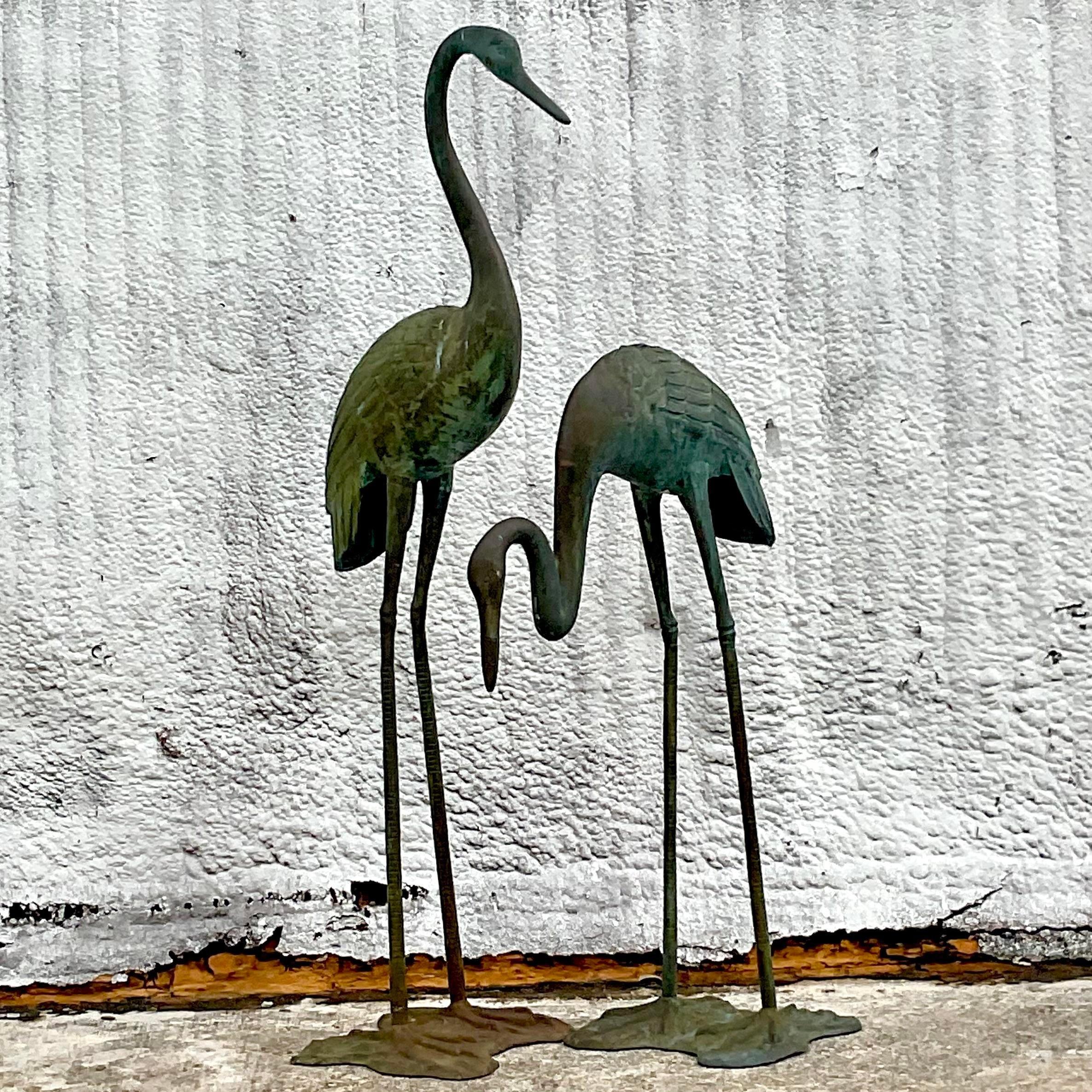 A stunning set of vintage Coastal Herons. Monumental in size and drama. Beautiful patinated finish on bronze. Acquired from a Palm Beach estate.

Smaller Heron 28x15.5x44