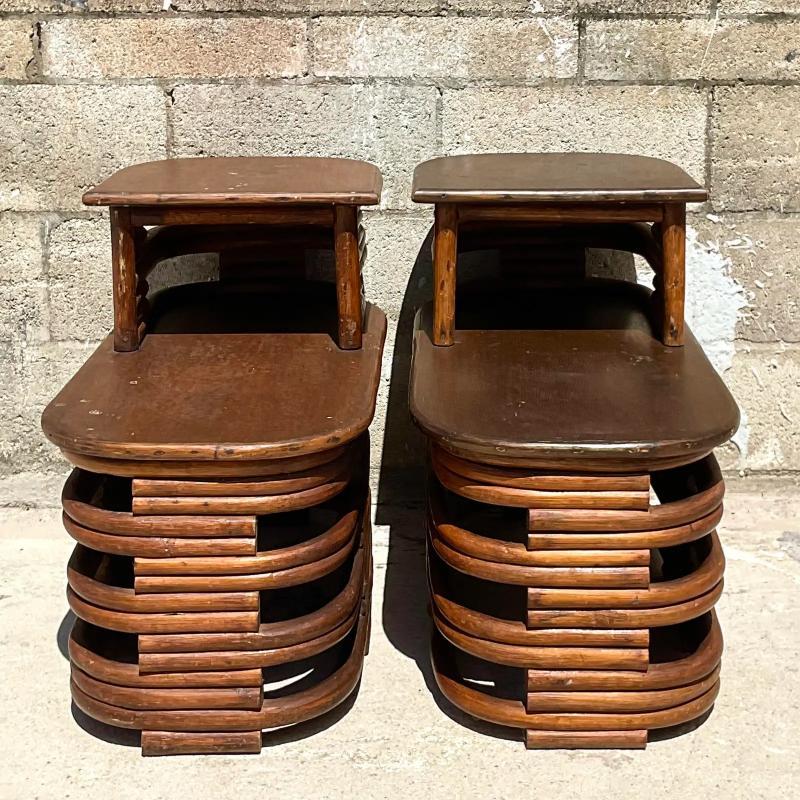 Stunning pair of vintage Coastal side tables. Beautiful stacked rattan with wooden table tops. Made by the iconic Paul Frankl. Unmarked. Acquired from a Palm Beach estate