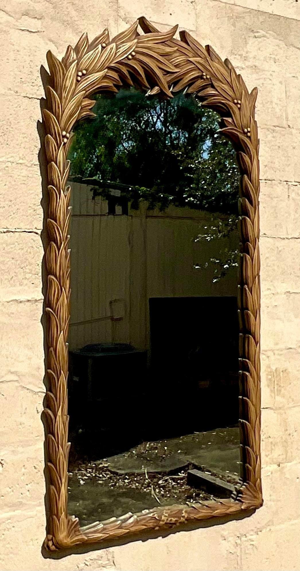 A vintage Boho molded wood mirror. The iconic Peacock Palm design in a glazed wood finish. Monumental in size and drama. Acquired from a Palm Beach estate. 