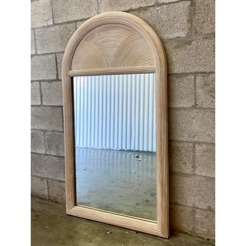 Fabulous vintage arched mirror. Made from a wrapped pencil reed with a cerused finish. Tall and dramatic. Acquired from a Palm Beach estate.