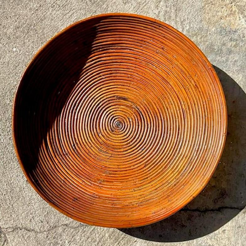 A beautiful Vintage Coastal bowl. Beautiful pencil reed construction in a coiled design. Acquired from a Palm Beach estate.