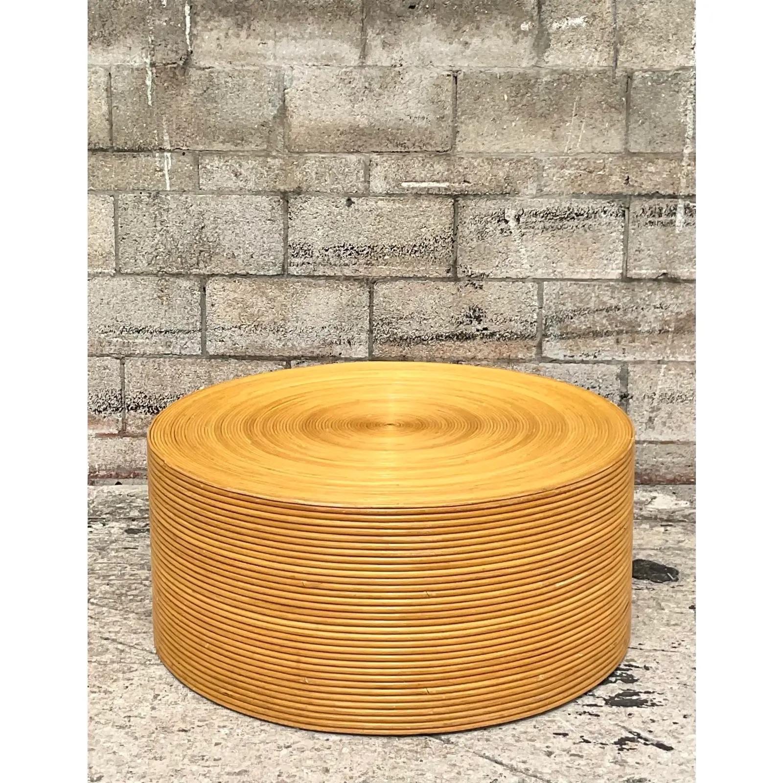 A fantastic vintage Coastal coffee table. Beautiful coiled pencil reed in a warm gold color. So perfect in so many spaces. Perfect as is or just add glass for a high traffic area. Acquired from a Palm Beach estate.