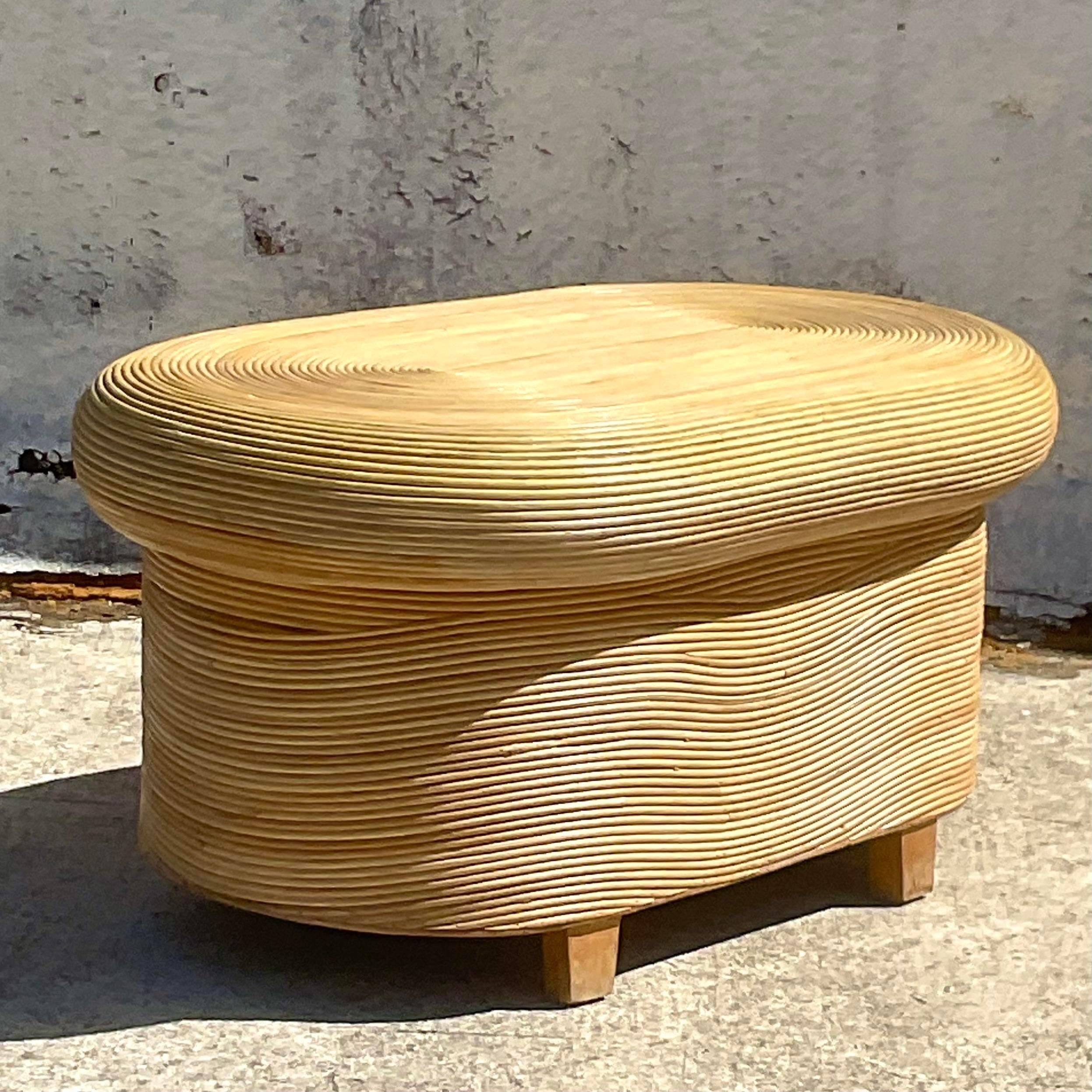 A fabulous vintage Coastal coffee table. A chic little mushroom shape in a pencil reed construction. Acquired from a Palm Beach estate.