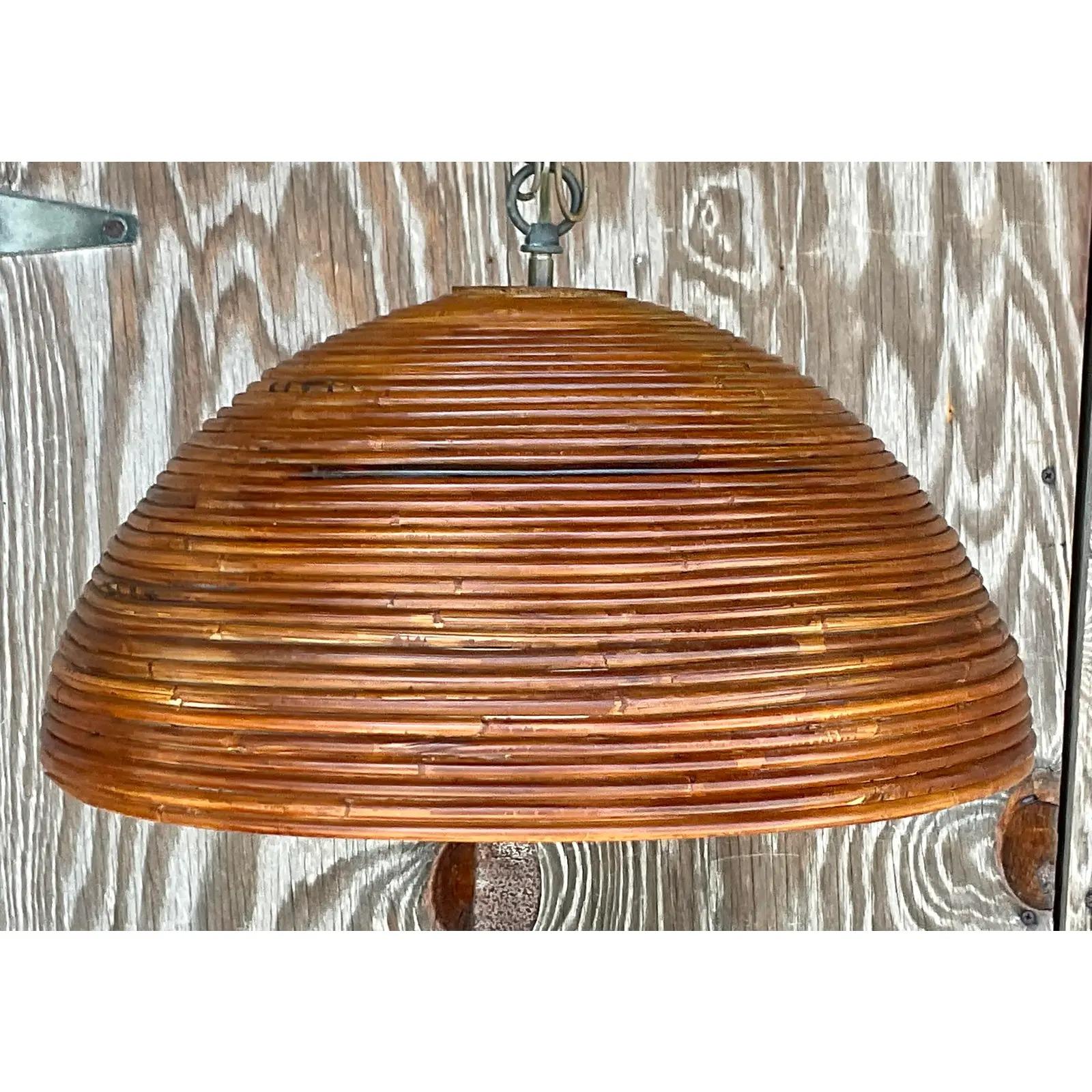 A fabulous vintage Costal chandelier. A beautiful pencil reed dome with beautiful warm patin from time. Acquired from a Palm Beach estate.