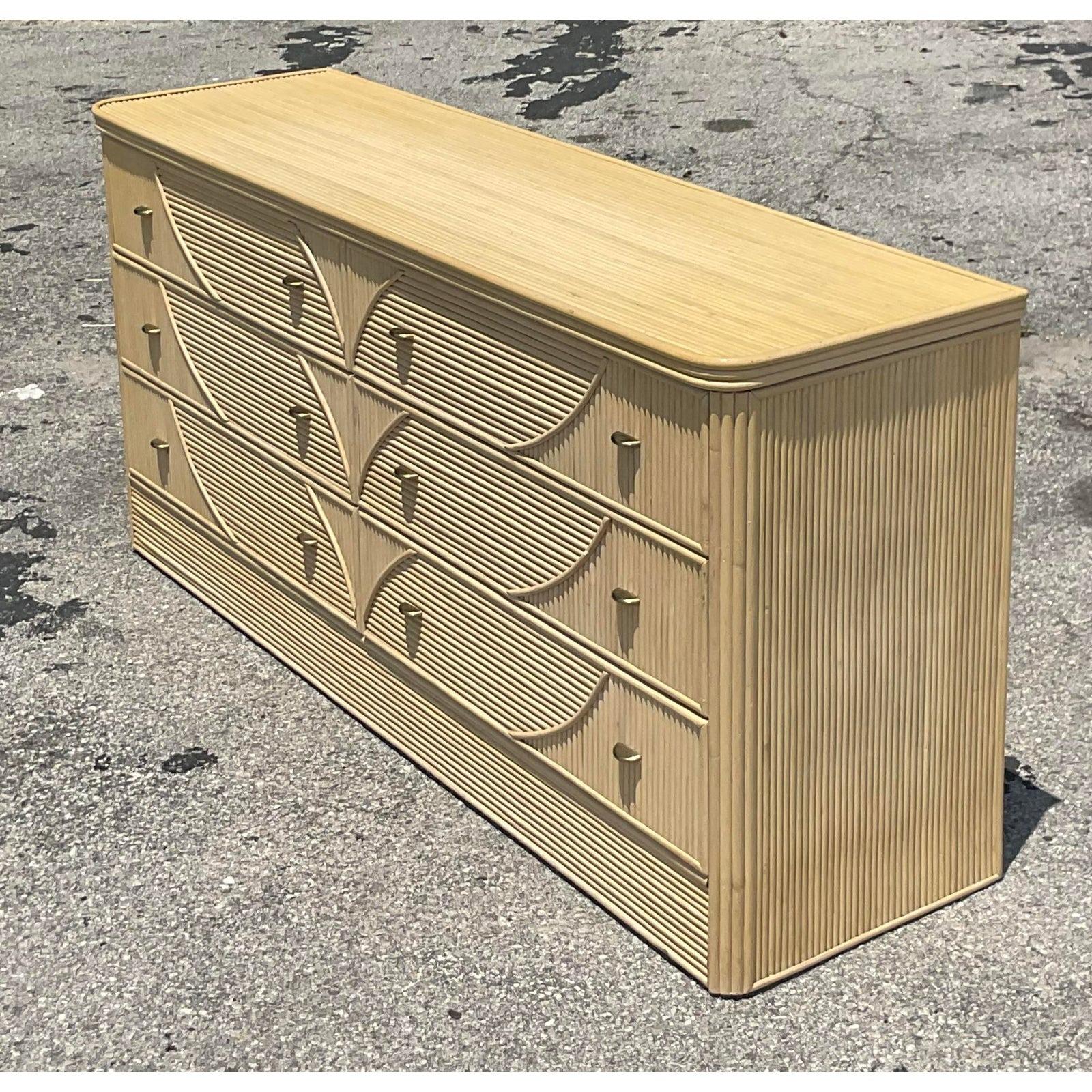 A fabulous vintage Coastal six drawer dresser. Beautiful cerused pencil reed construction with a chic leaves pattern. Acquired from a Palm Beach estate.