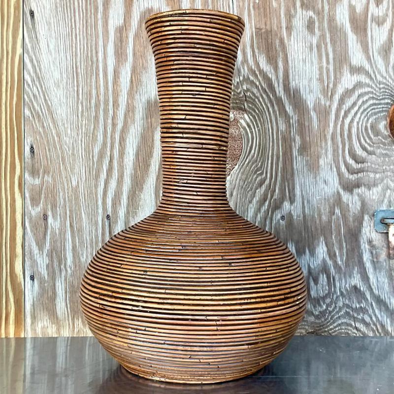 A fabulous vintage Coastal floor vase. Beautiful pencil reed coiled construction. Monumental in size and drama. Acquired from a Palm Beach estate. 