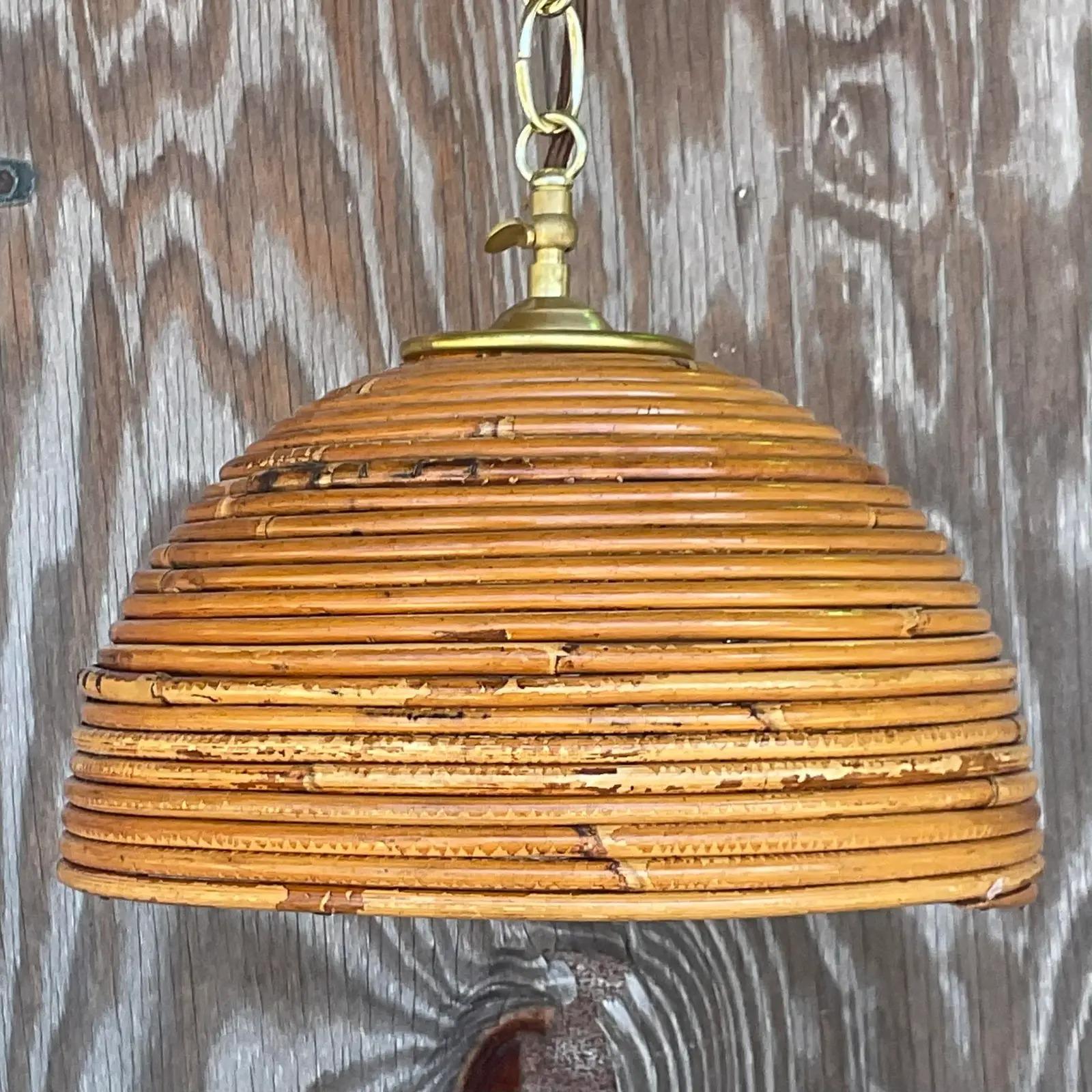 Fabulous vintage Coastal chandelier. A beautiful pencil reed dome with brushed brass hardware. Fully restored with all new hardware and brown silk wrapped cord. Acquired from a Palm Beach estate.

The light is in great vintage condition. Minor