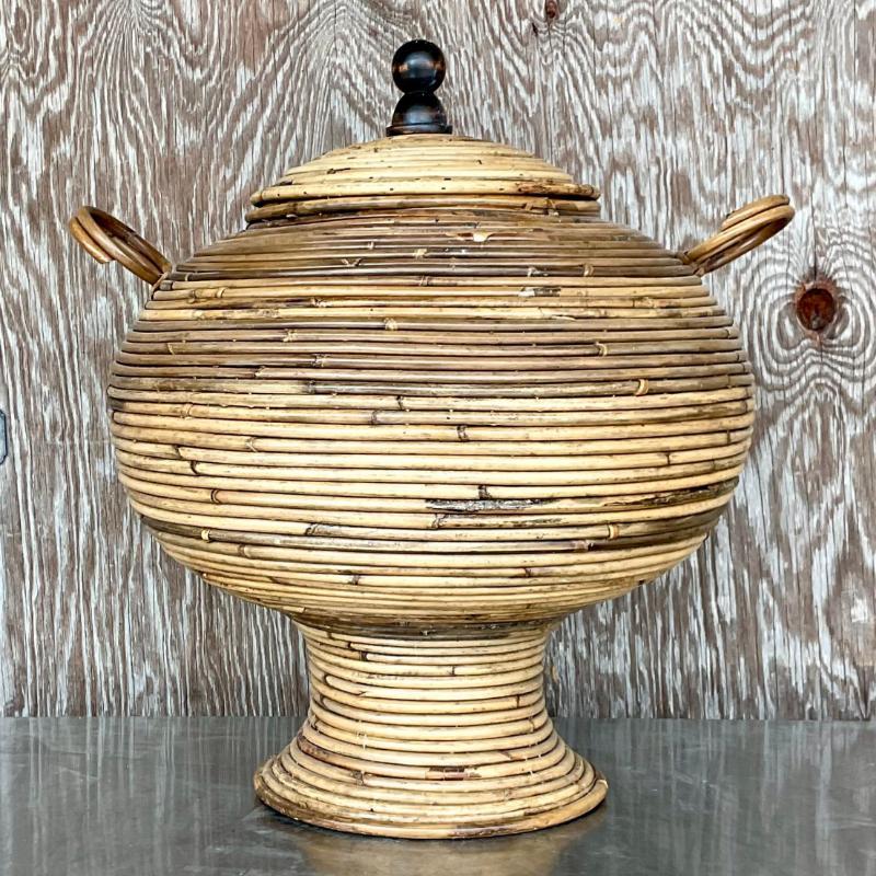 A fabulous vintage Coastal lidded urn. A chic pencil reed in warm neutral tones. Acquired from a Palm Beach estate.