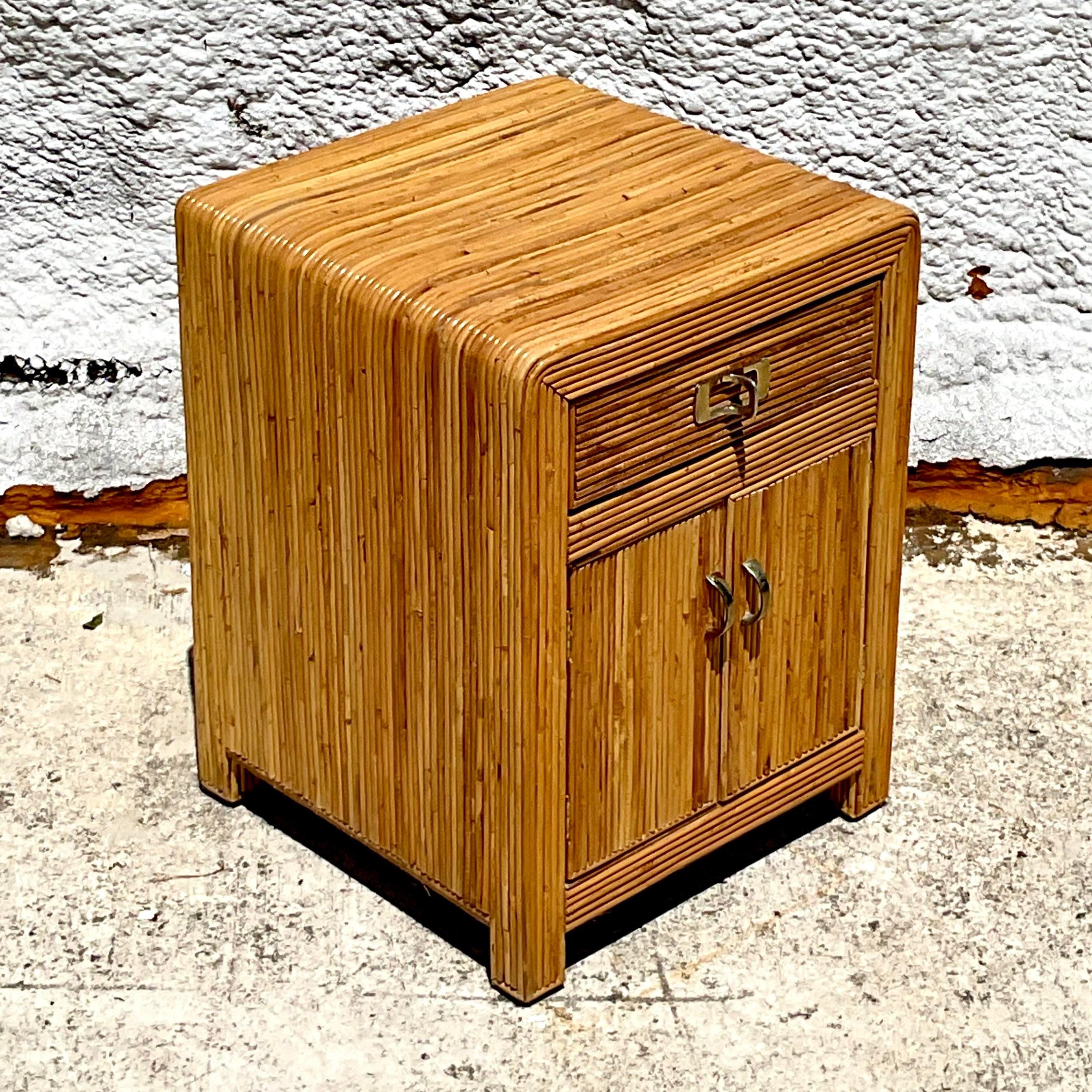 Add a touch of coastal charm to your bedroom with this Vintage Coastal Pencil Reed Nightstand. Featuring elegant pencil reed detailing and ample storage, this nightstand combines function and style perfectly. Ideal for creating a serene, beachy vibe