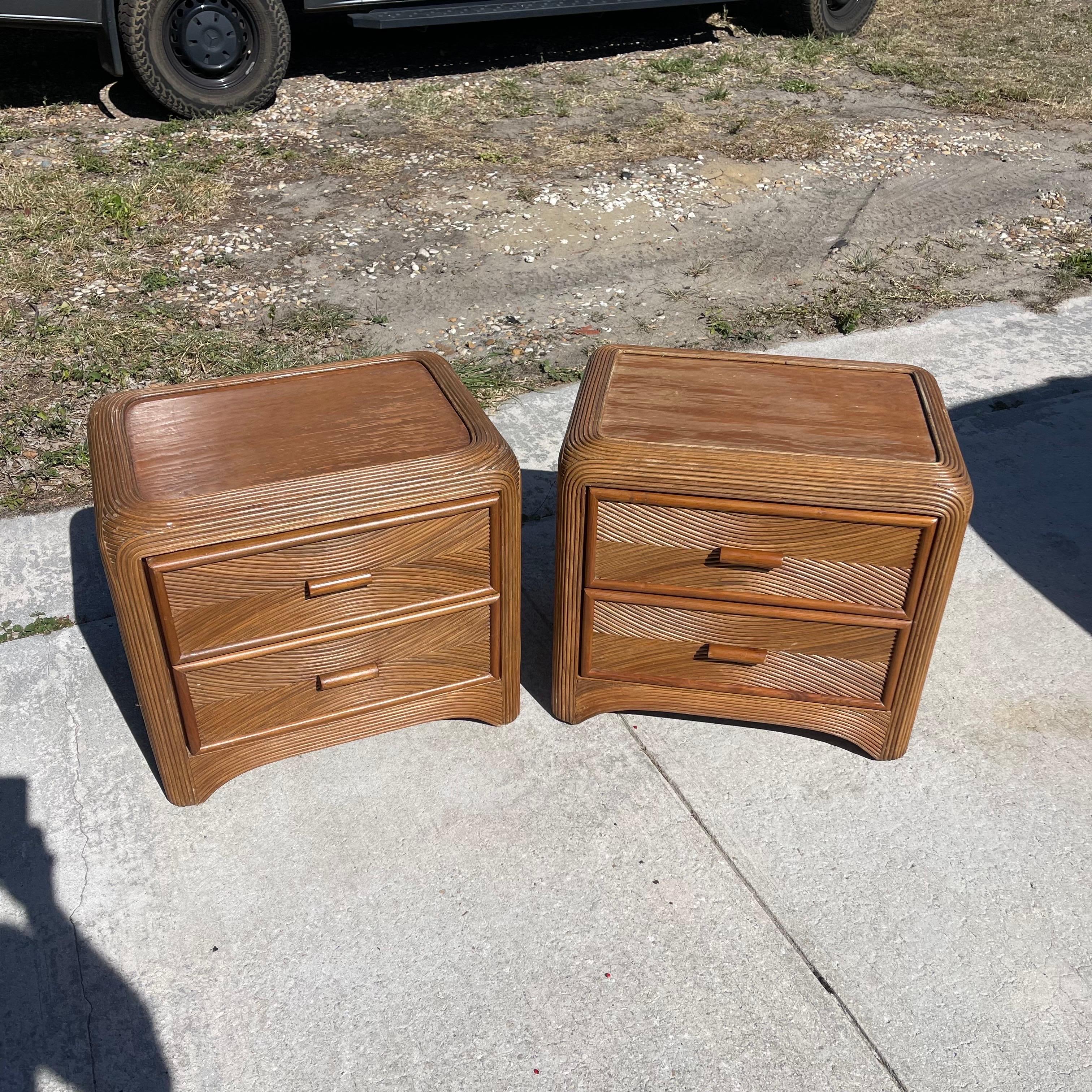Fabulous pair of vintage pencil reed nightstands, each with 2 drawers.