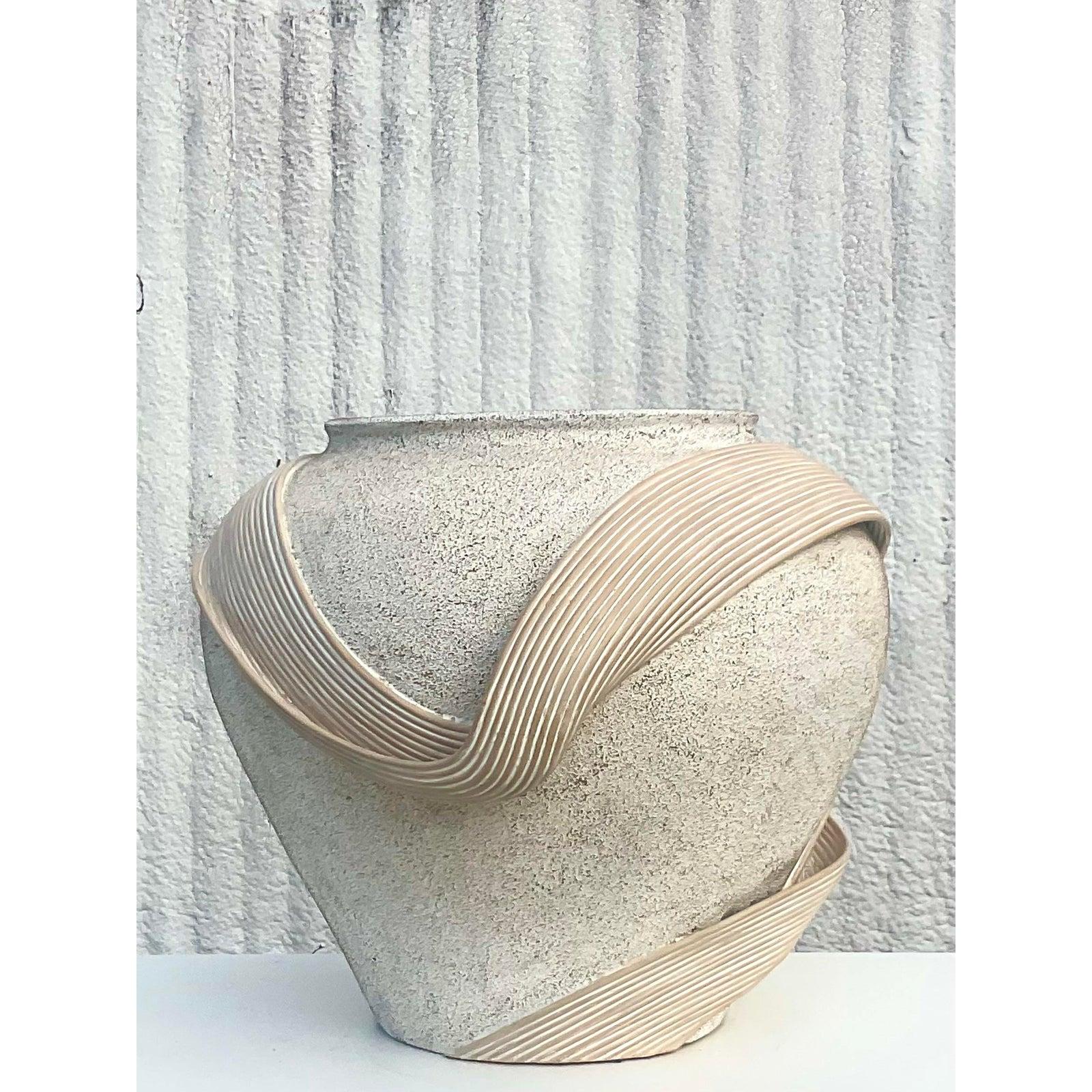Stunning vintage Coastal urn. A monumental plaster urn with a chic band of pencil reed wrapped around like a ribbon. Large and impressive. Dine in the manner of Betty Copuncpue. Acquired from a Palm Beach estate.