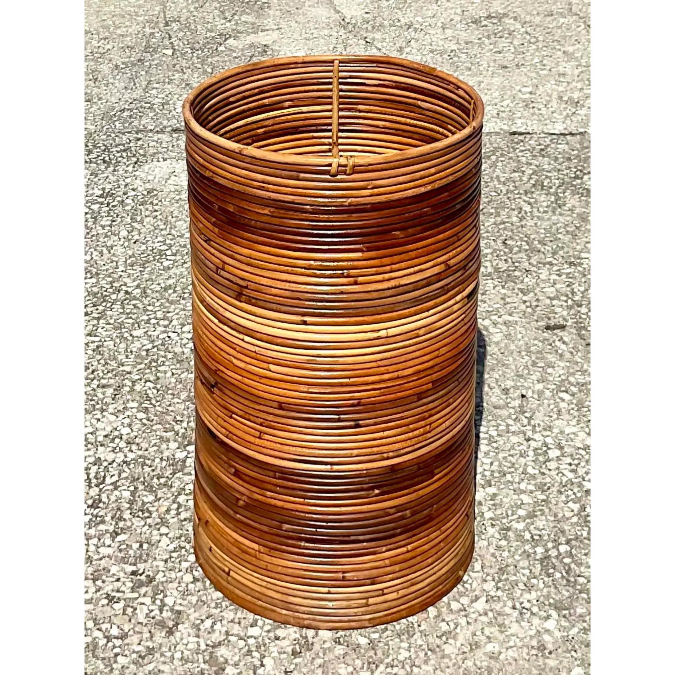 Fantastic vintage Coastal tall basket. Made from beautiful tortoise pencil reed in an ombré color design. Perfect indoors or out side in a covered area. Super chic. Acquired from a Palm Beach estate