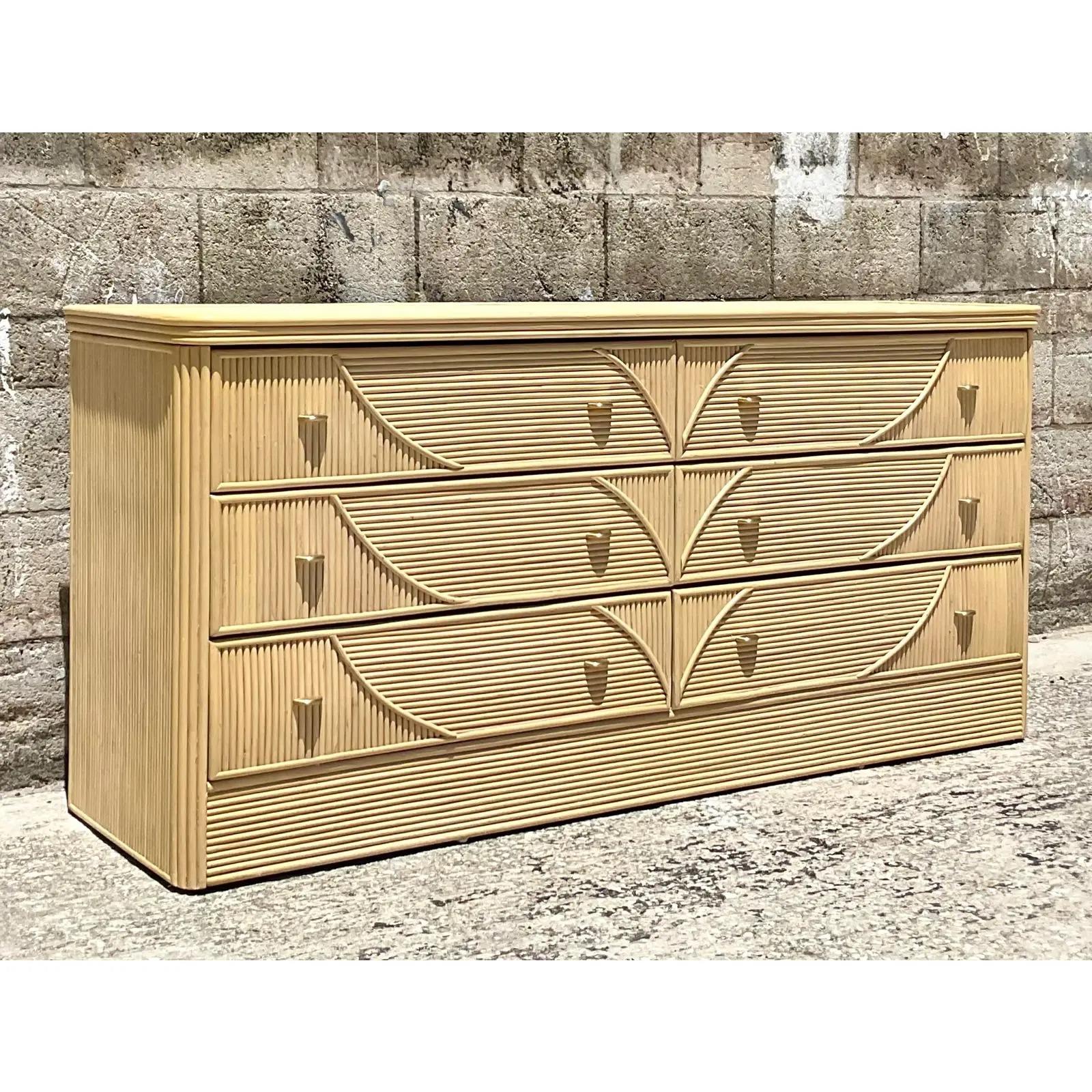 Fantastic vintage Coastal standard dresser. Beautiful pencil reed cabinet with a chic tree design on front. Acquired from a Palm Beach estate.