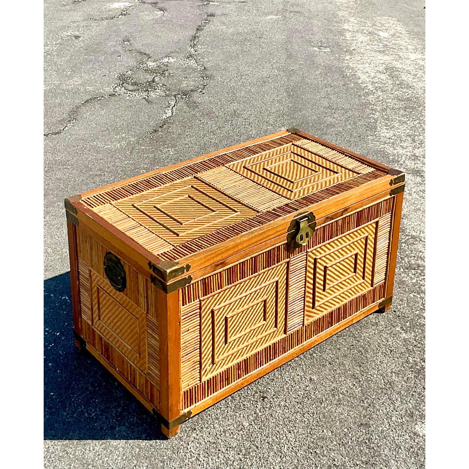 Fantastic vintage pencil reed trunk. Wood frame with inset reed panels. Hammered brass hardware. Acquired from a Palm Beach estate.