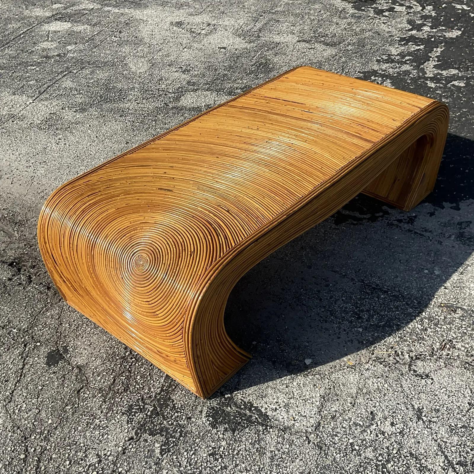 Vintage coastal waterfall coffee table. Beautiful pencil reed construction with the coveted Sunburst design. Done in the manner of Gabriella Crespi. Acquired from a Palm Beach estate.