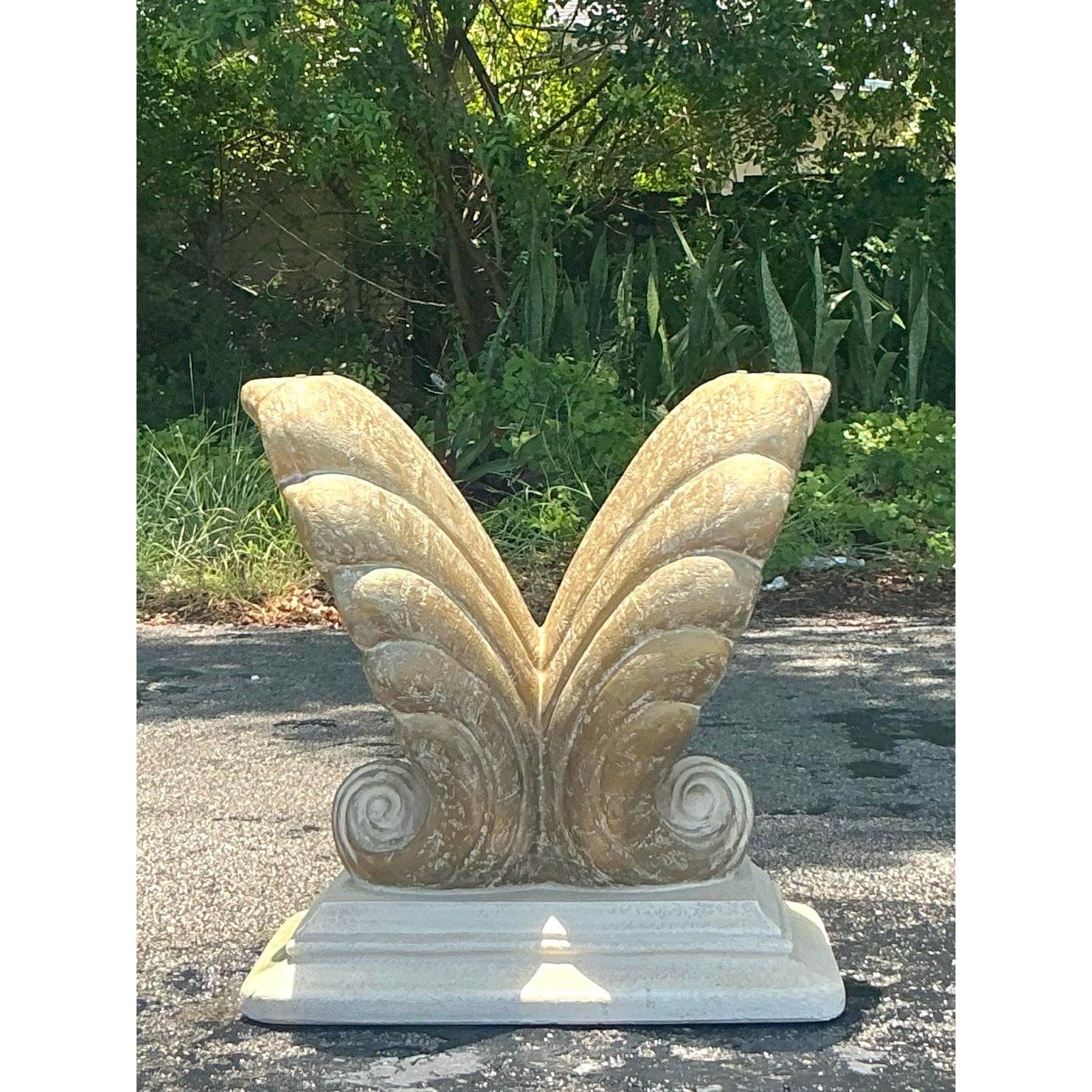 Infuse your interior with the dramatic elegance of the coast with this monumental vintage clam shell table pedestal. This stunningly sculptural piece features two massive, stylized shells forming a dynamic V-shape, resting on a sturdy plinth with