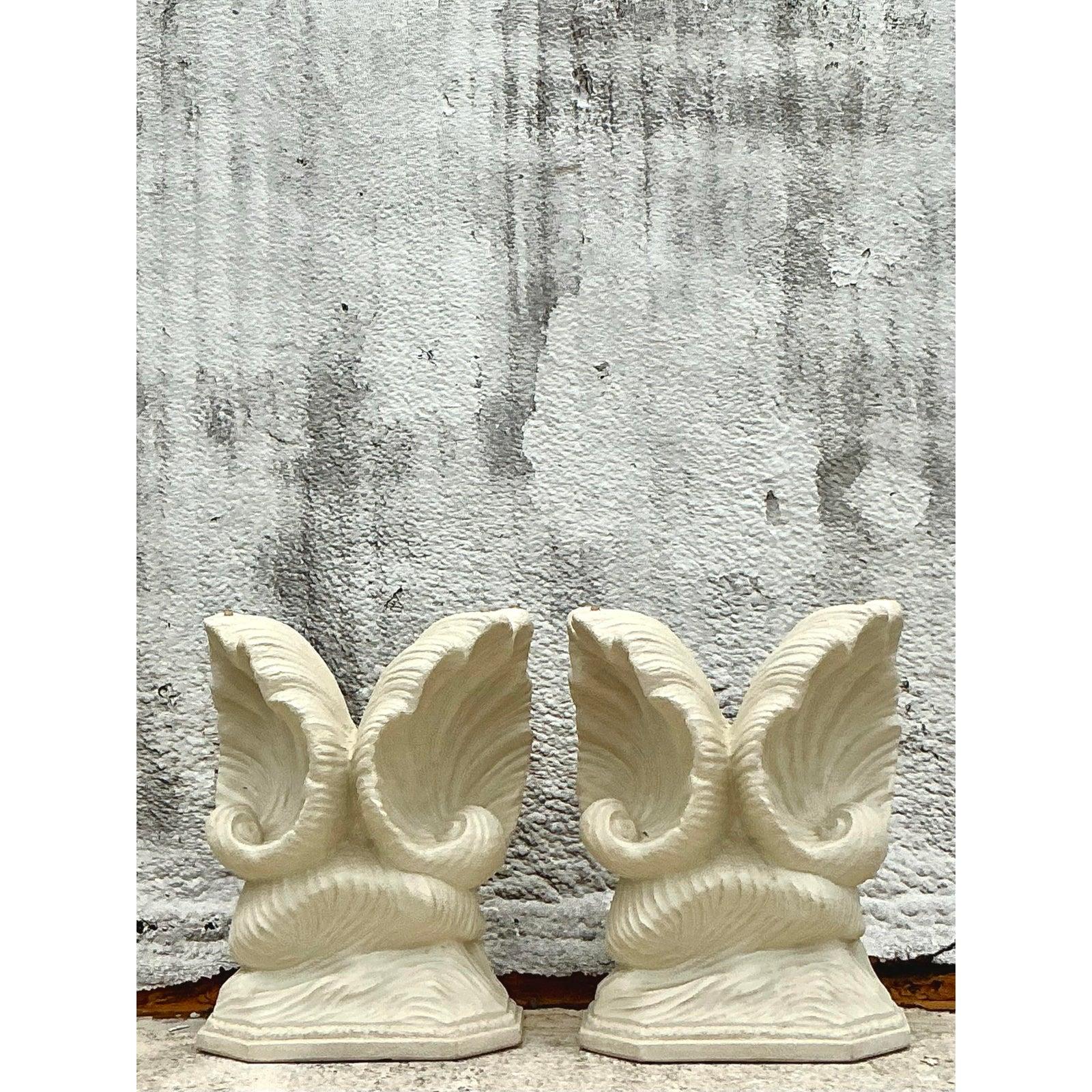 Introduce an unparalleled touch of coastal elegance and sculptural grandeur with this exquisite Vintage Coastal Plaster Clam Shell Table Pedestal Set. Each meticulously crafted pedestal replicates the organic, fluted beauty of a natural clam shell,